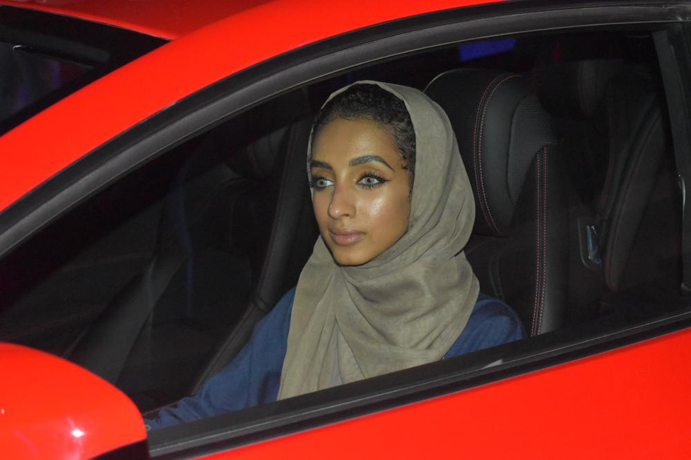 A woman in a Ferrari at the event titled “Saudi women can drive Italian” on March 02.2018.