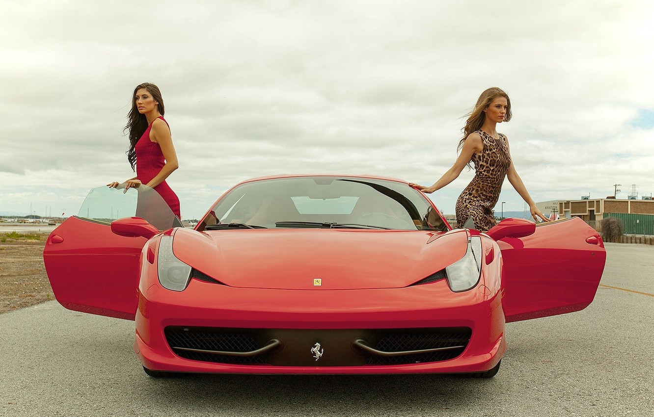 Two girls and a red Ferrari.