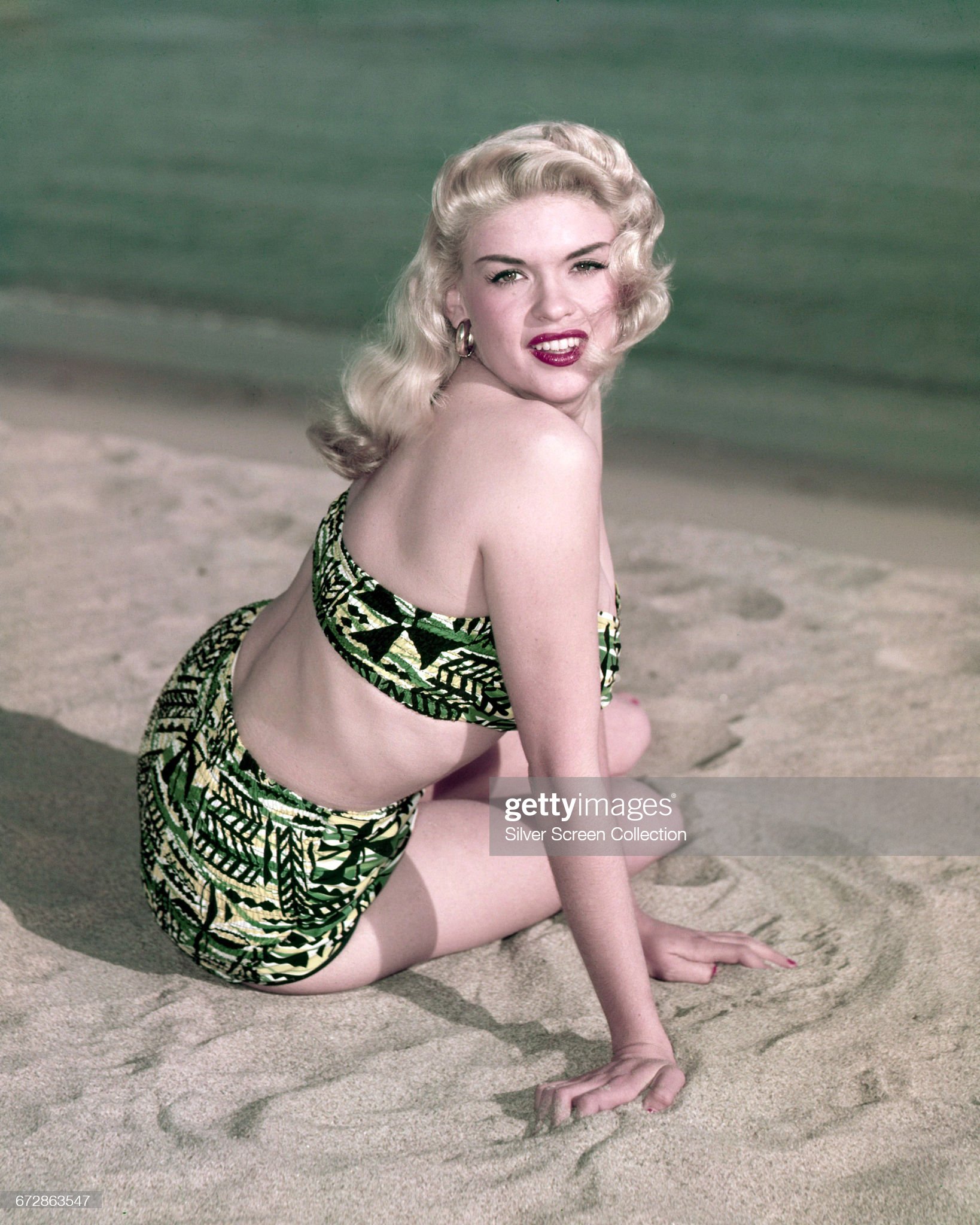 Jayne Mansfield posing on the beach in a bikini, circa 1955.
