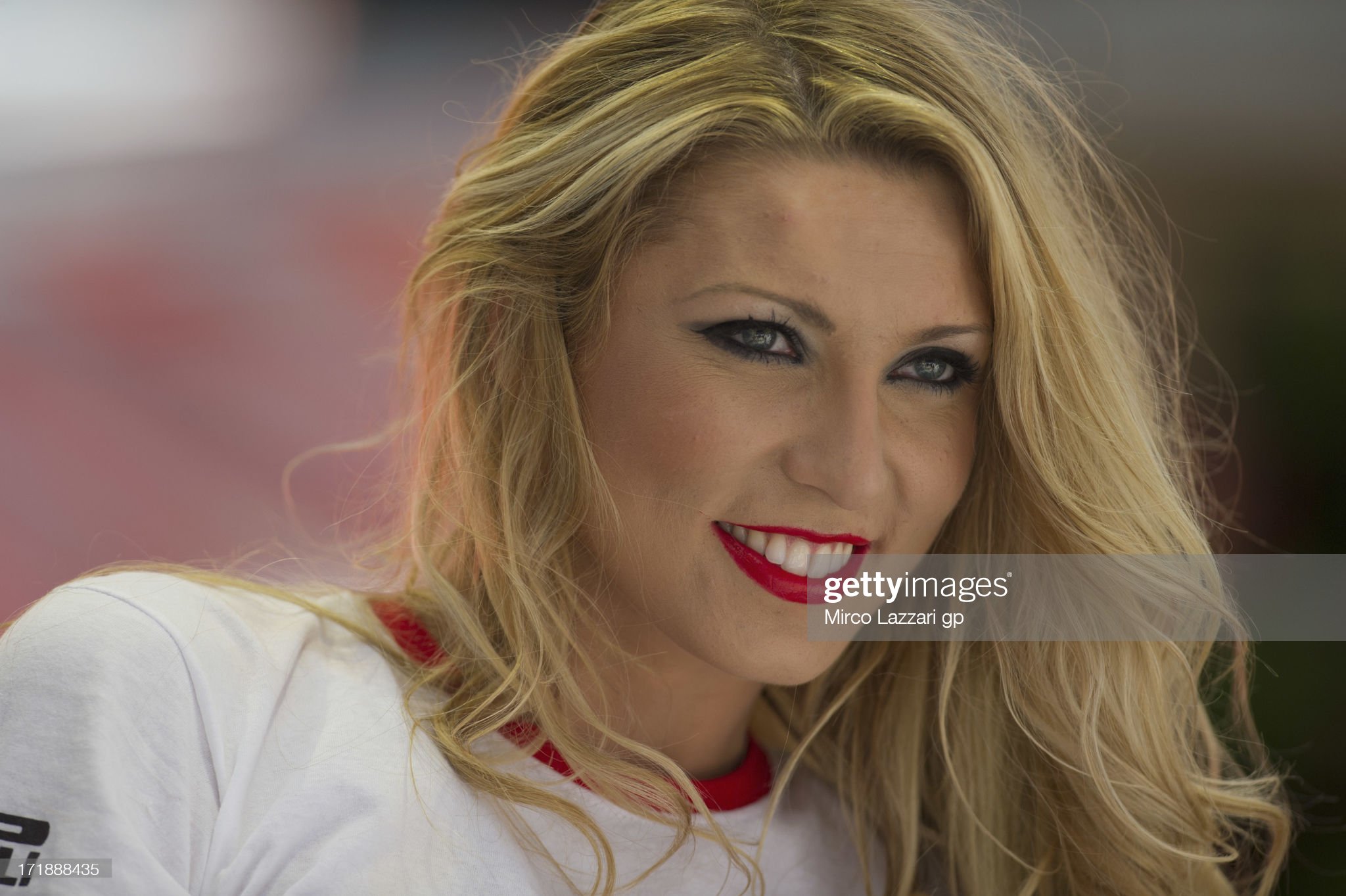 A grid girl poses during the round seven of 2013 Superbike FIM World Championship on June 29, 2013 in Imola, Italy.