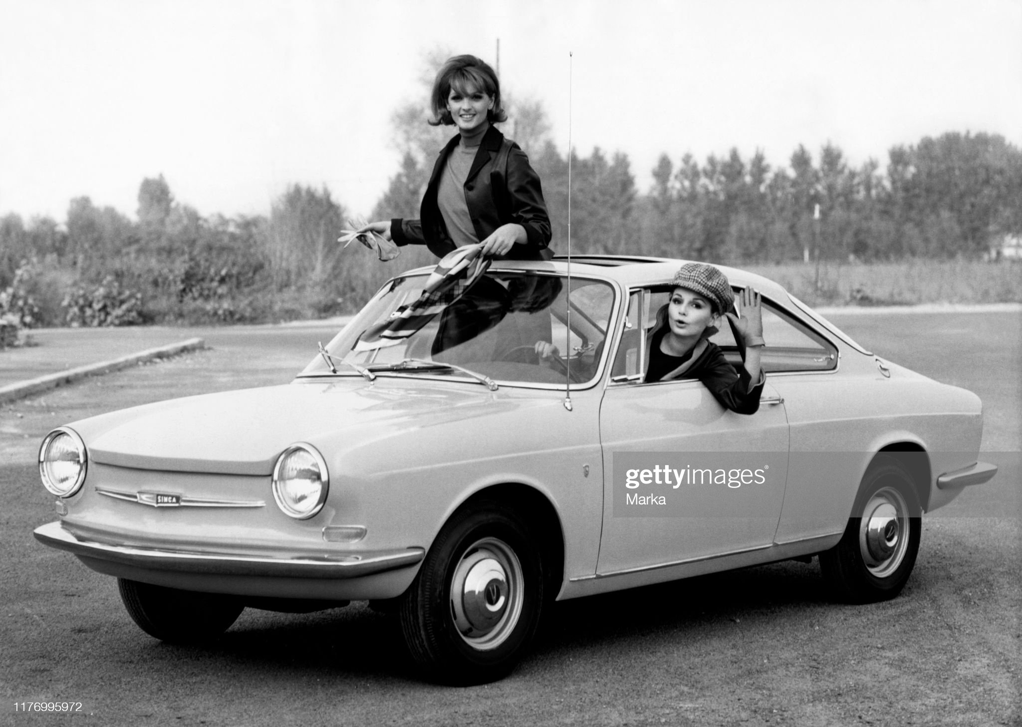 Two girls in a Simca 1000 coupe, Bertone body, in 1963.