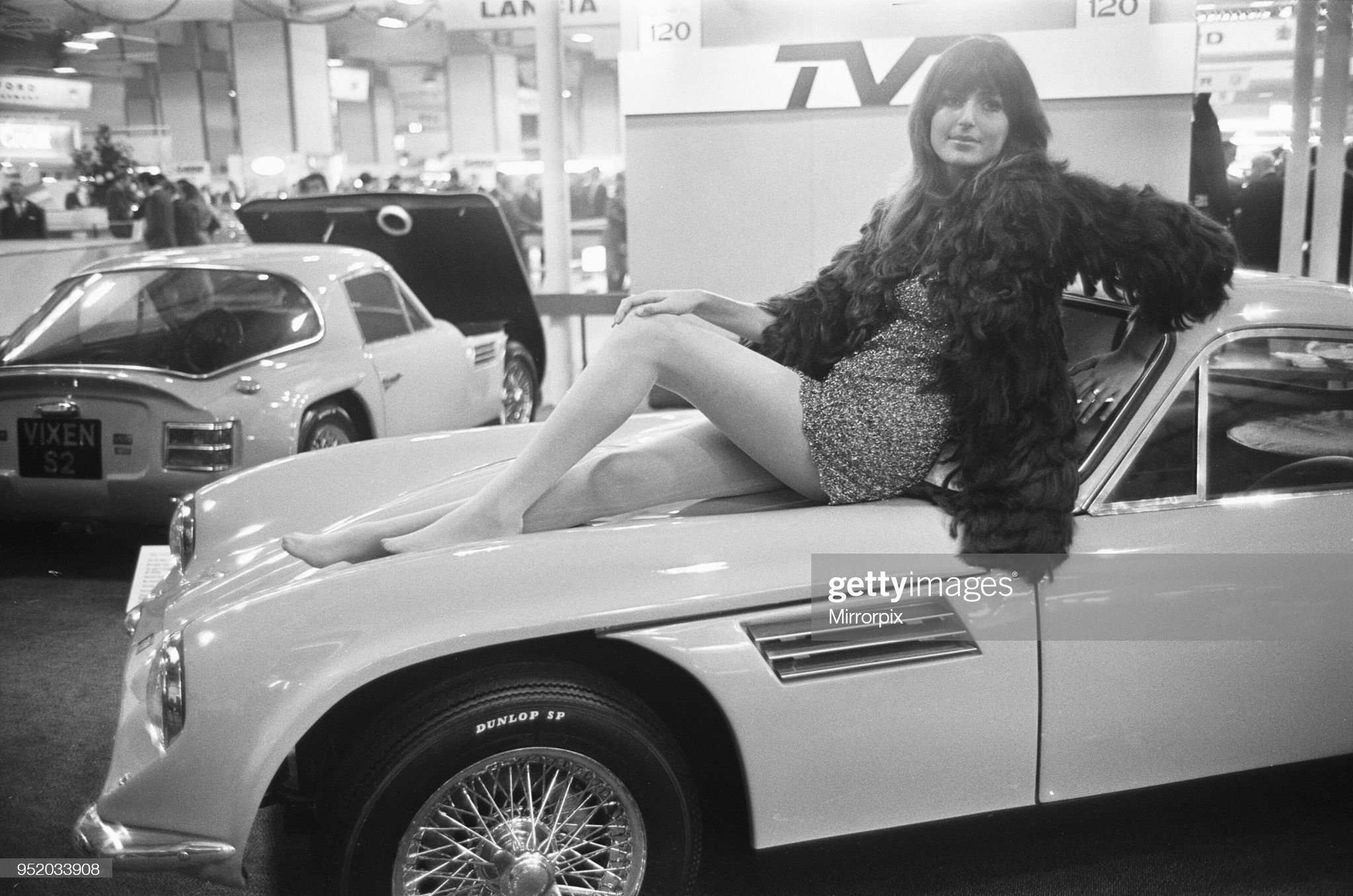 Model poses on the bonnet of a TVR at a Motor Show on 15 October 1968. 