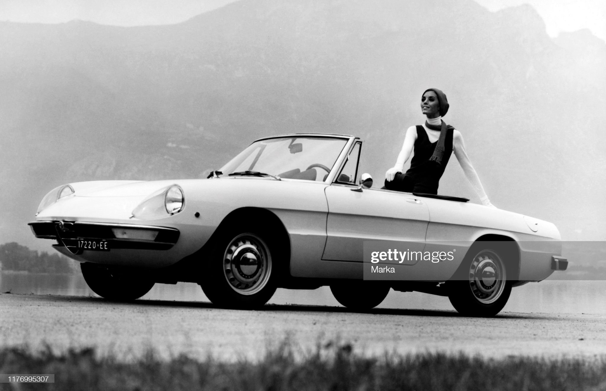 A woman in a Duetto Alfa Romeo 1750 spider veloce in 1969. 