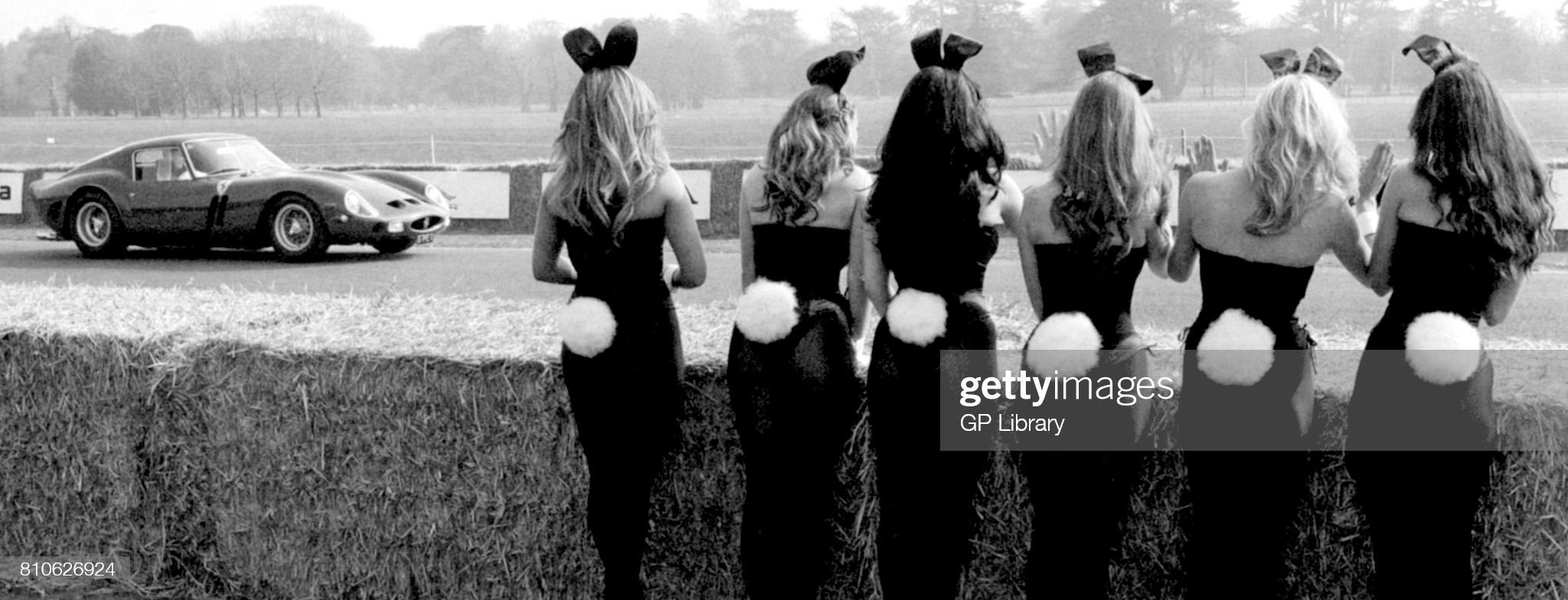 Bunny Girls watching Paul Vestey in a Ferrari 250 GTO at the Goodwood Festival of Speed on December 31, 1969.