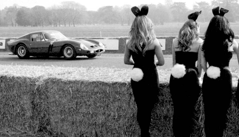 Bunny Girls watching Paul Vestey in a Ferrari 250 GTO at the Goodwood Festival of Speed on December 31, 1969.