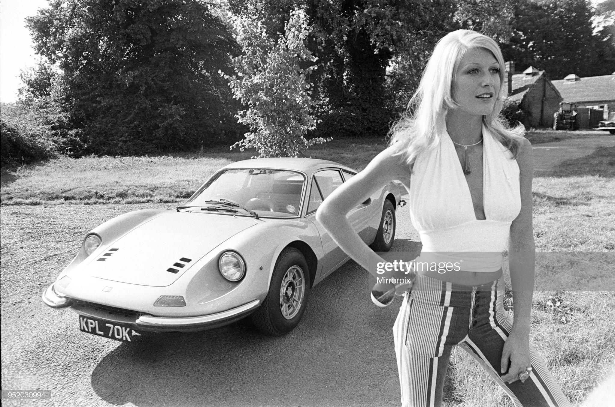 Reveille model Heidi seen here posing with a Ferrari Dino GT circa 1972.