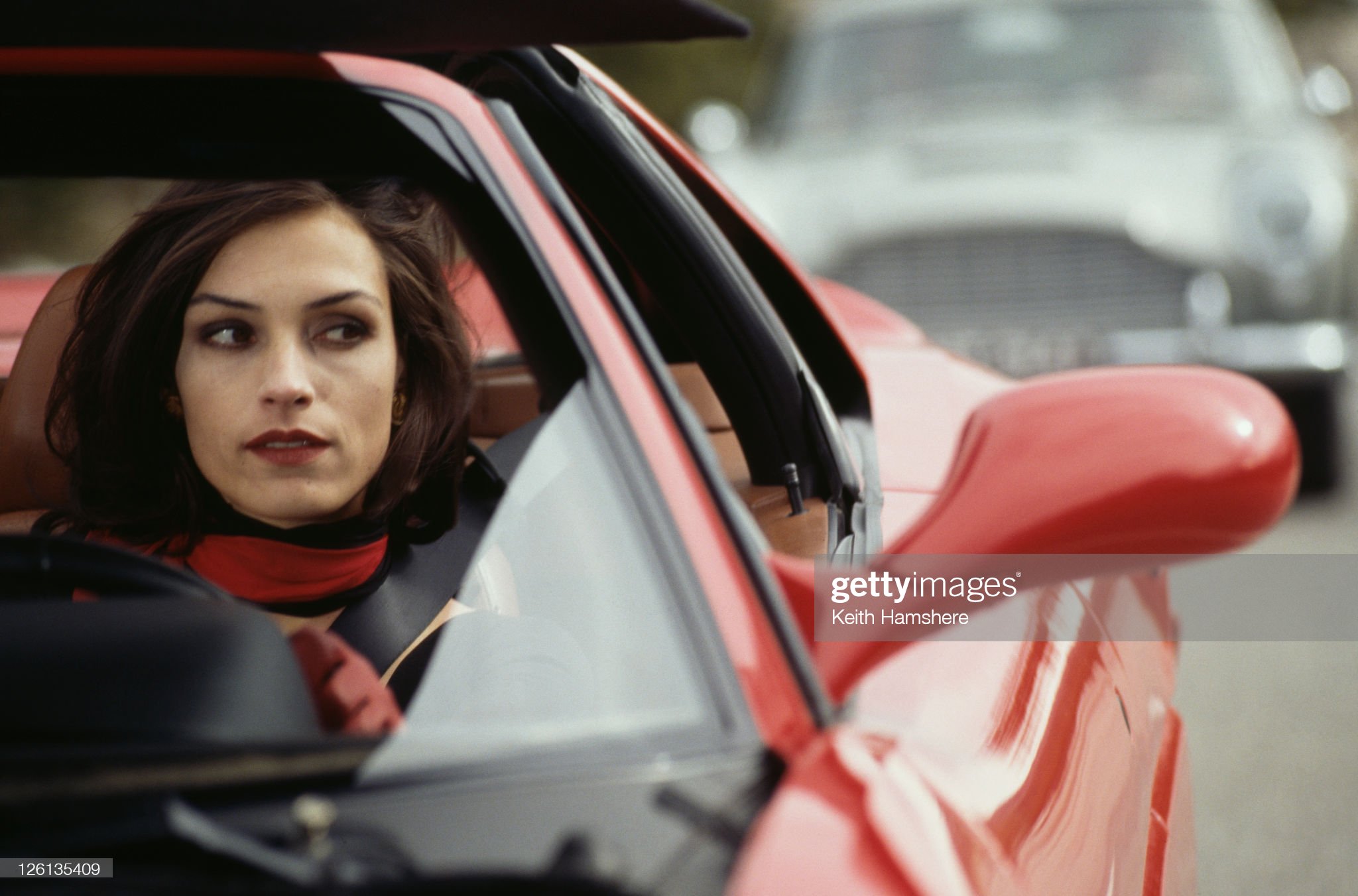 Dutch-born actress Famke Janssen driving a Ferrari F355 GTS as the villainous Xenia Onatopp, in the James Bond film 'Golden eye', 1995. 