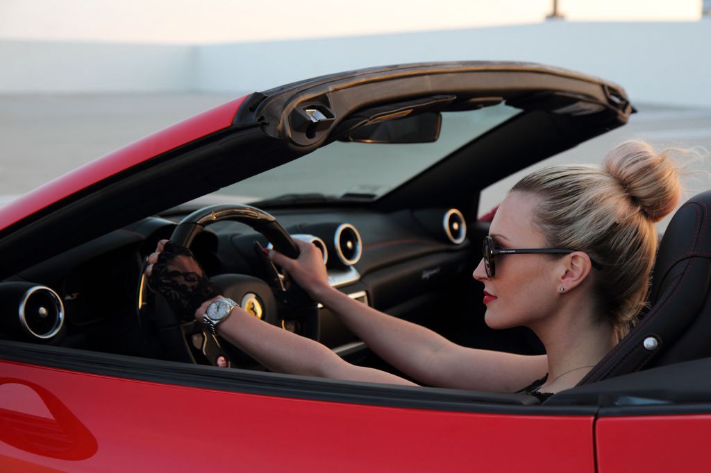 A Ferrari California T and a sexy blonde girl.