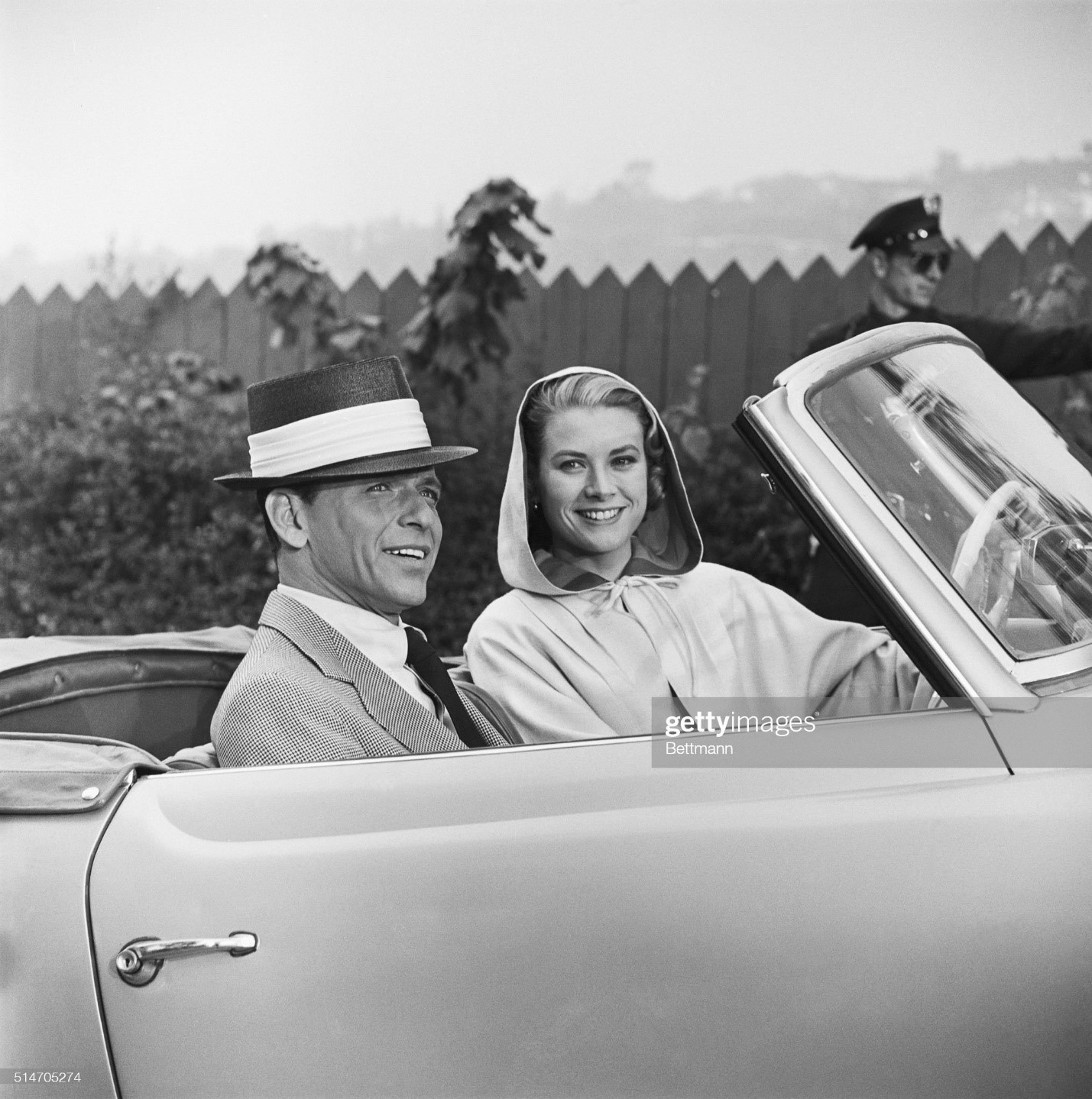 Grace Kelly and Frank Sinatra in an open convertible on the set of the Cole Porter musical High Society on January 19, 1956. A duet with Bing Crosby earned Kelly her only gold record. Within months of this photograph, Kelly wed Prince Rainier of Monaco. 