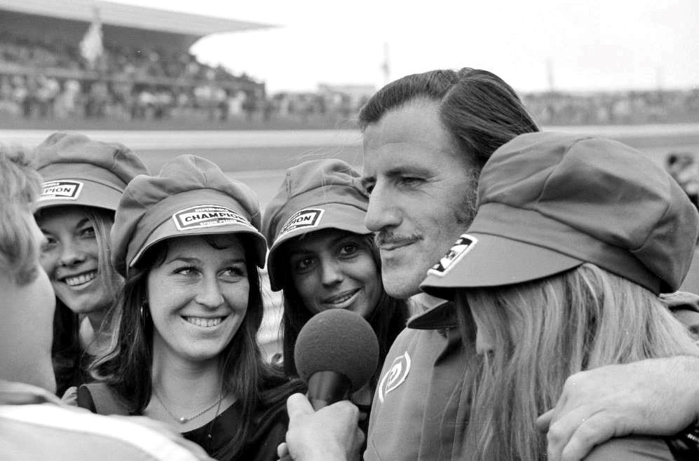 Graham Hill and the grid girls.