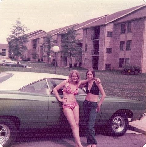 Two vintage girls and a car.