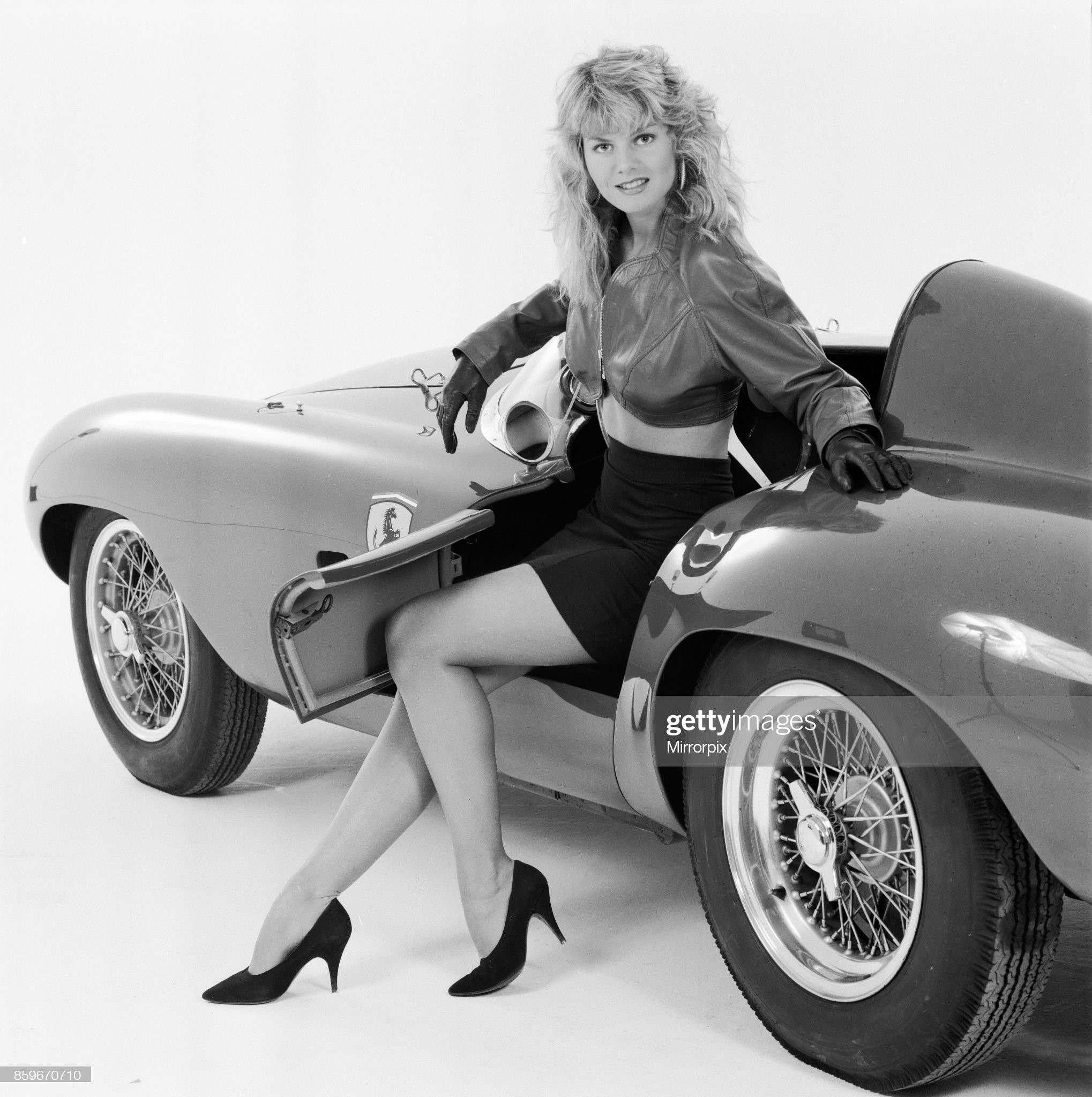 Glamour model Caroline Delahunty poses in a Ferrari, 19th April 1988.