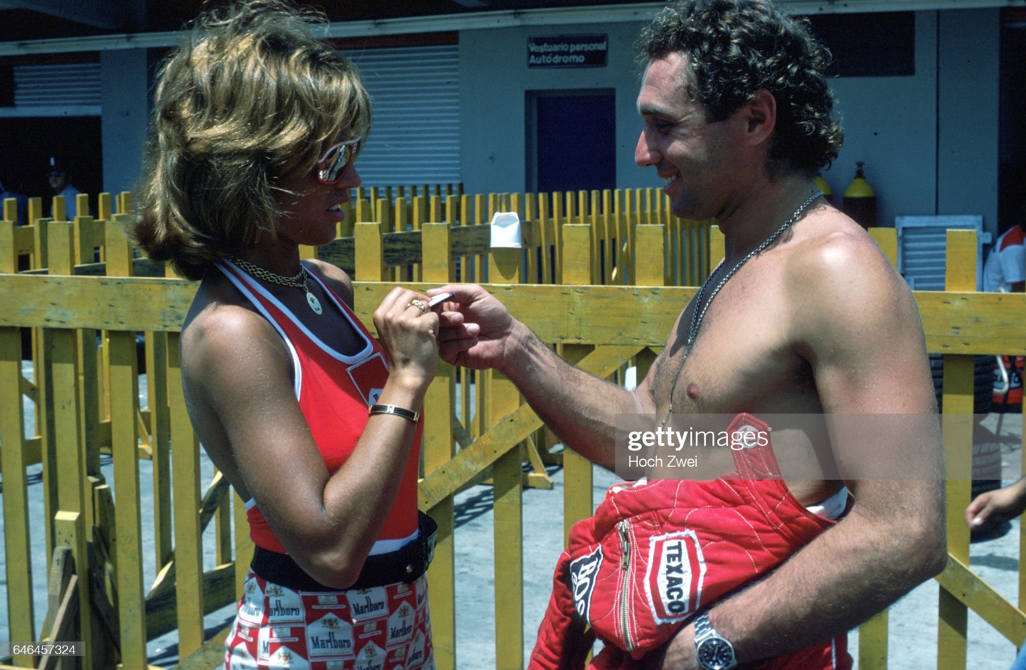Jochen Mass with a Marlboro girl at the Argentinean Grand Prix on January 09, 1977. 