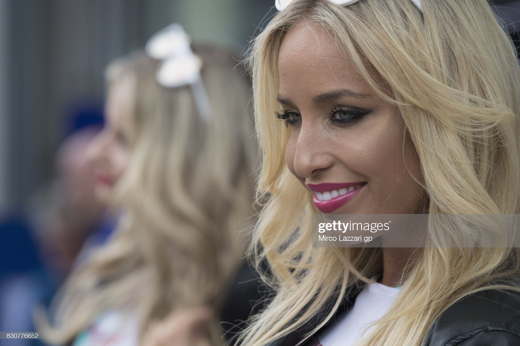 A grid girl smiles in paddock during the qualifying of the MotoGp World Championship at Red Bull Ring on August 12, 2017 in Spielberg, Austria. 