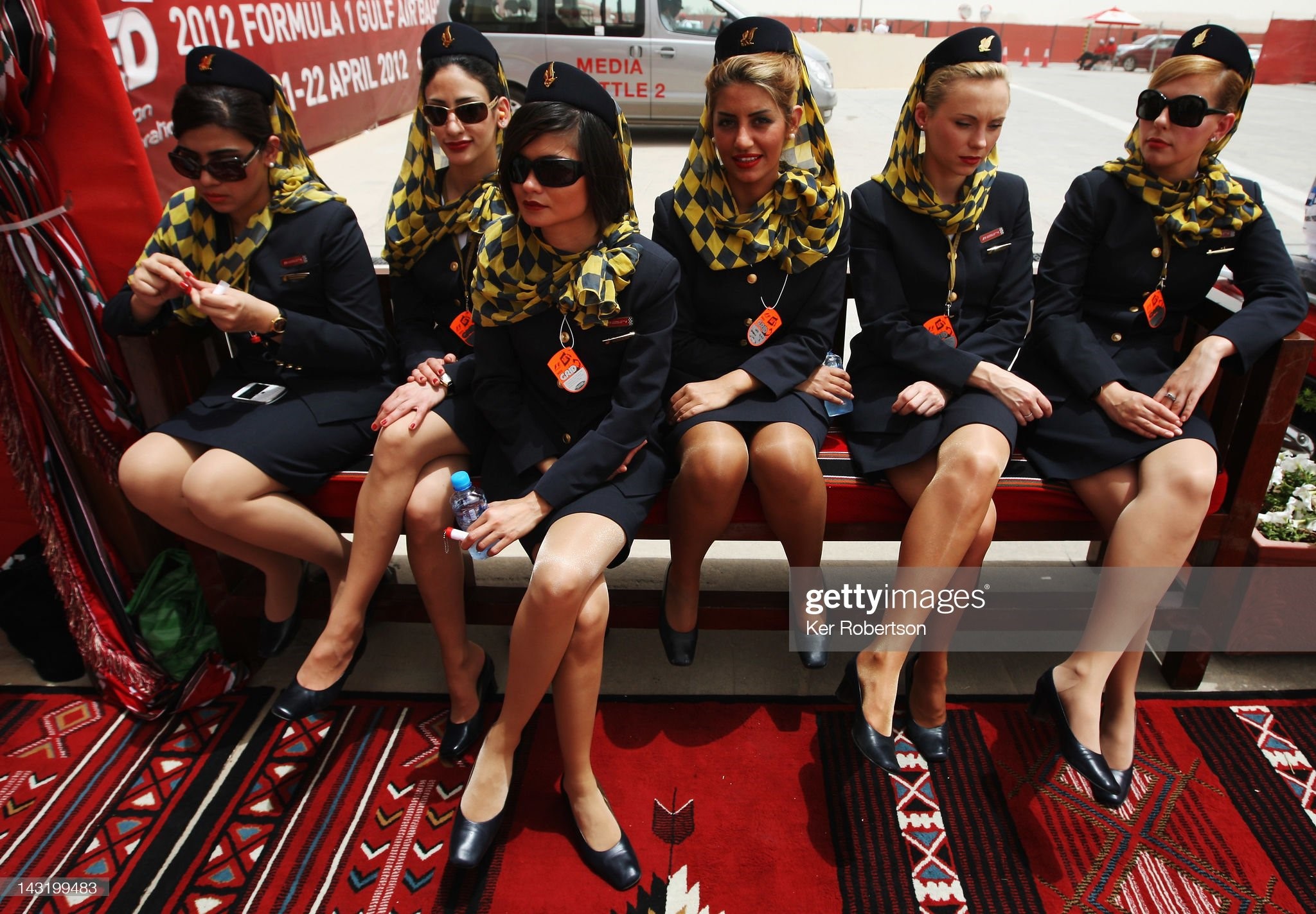 Grid girls are seen before qualifying for the Bahrain Formula One Grand Prix at the Bahrain International Circuit on April 21, 2012 in Sakhir, Bahrain. 