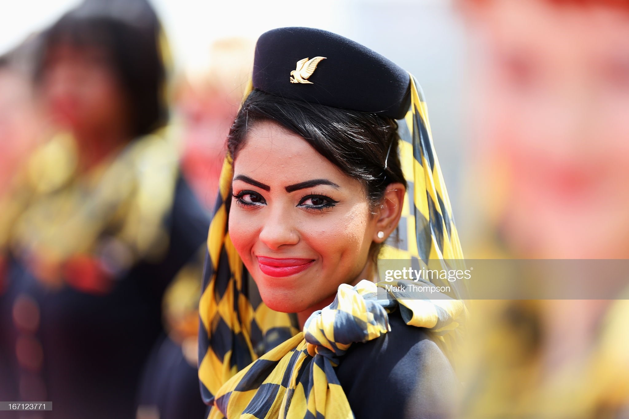 Grid girls are seen at the drivers parade before the Bahrain Formula One Grand Prix at the Bahrain International Circuit on April 21, 2013 in Sakhir, Bahrain.