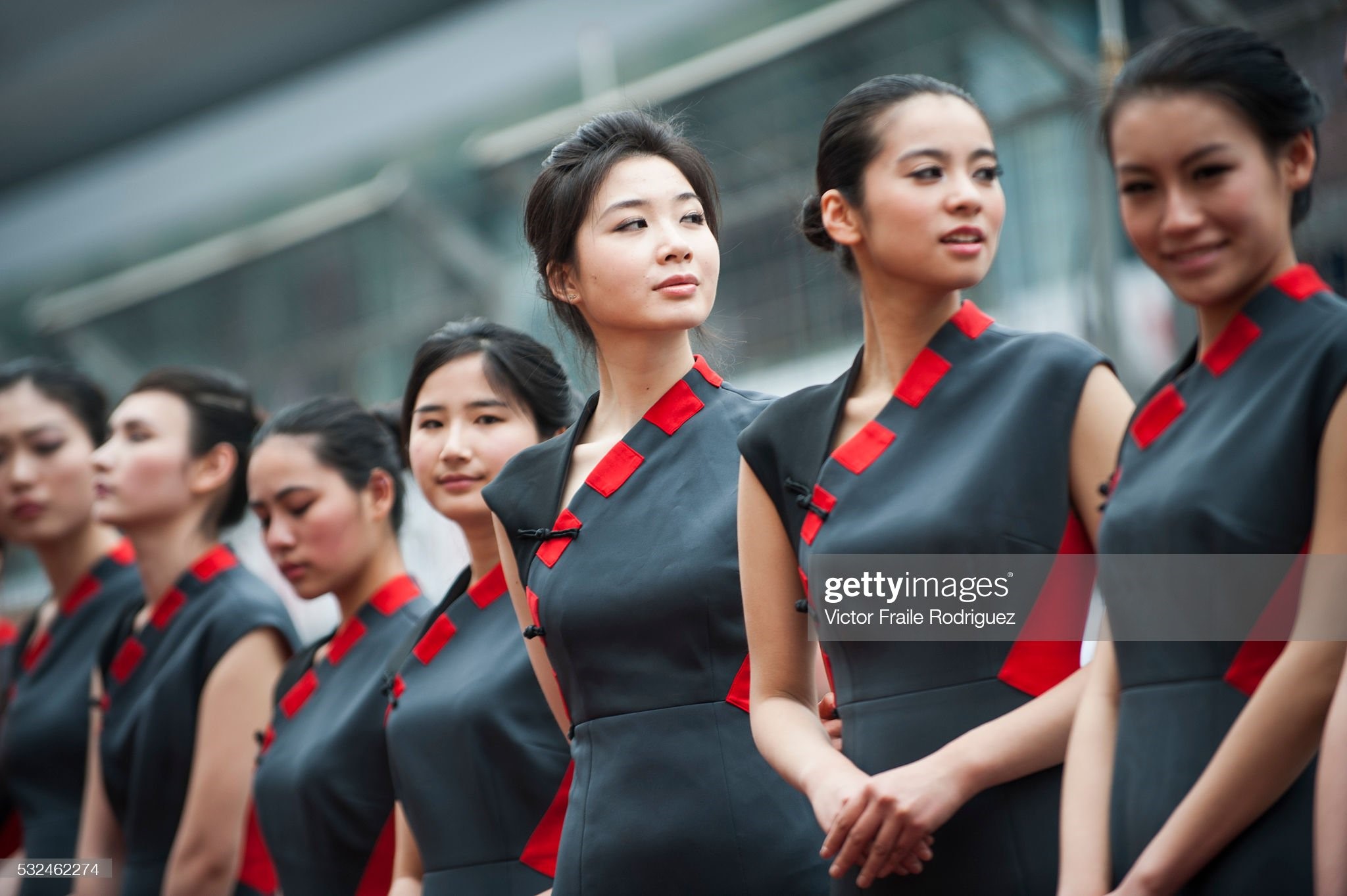 Chinese grid girls pose at the pit lane during the Chinese F1 Grand Prix at Shanghai International circuit on April 13, 2012. 