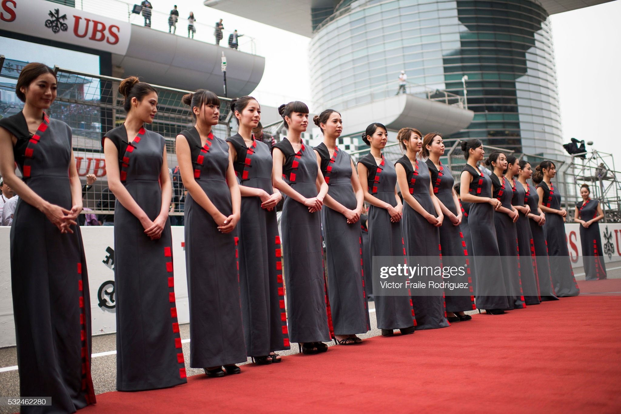Chinese grid girls pose at the pit lane during the Chinese F1 Grand Prix at Shanghai International circuit on April 13, 2012. 