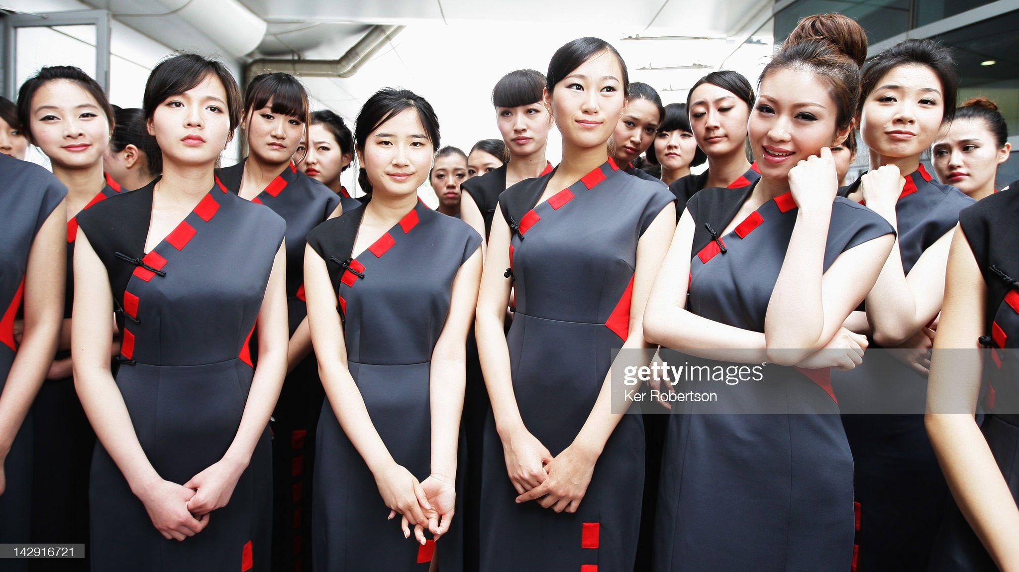 Grid girls attend the drivers parade before the Chinese Formula One Grand Prix at the Shanghai International Circuit on April 15, 2012 in Shanghai, China. 