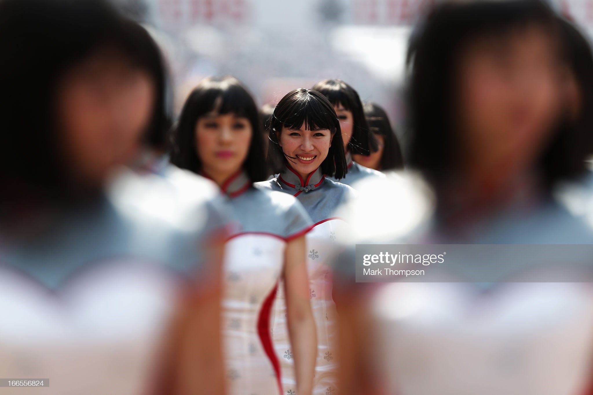 Grid girls line up for the drivers parade before the Chinese Formula One Grand Prix at the Shanghai International Circuit on April 14, 2013 in Shanghai, China. 
