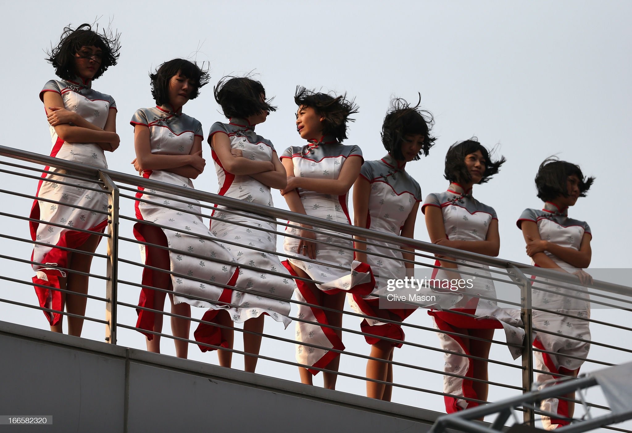 Grid girls line up before the podium ceremony following the Chinese Formula One Grand Prix at the Shanghai International Circuit on April 14, 2013 in Shanghai, China. 