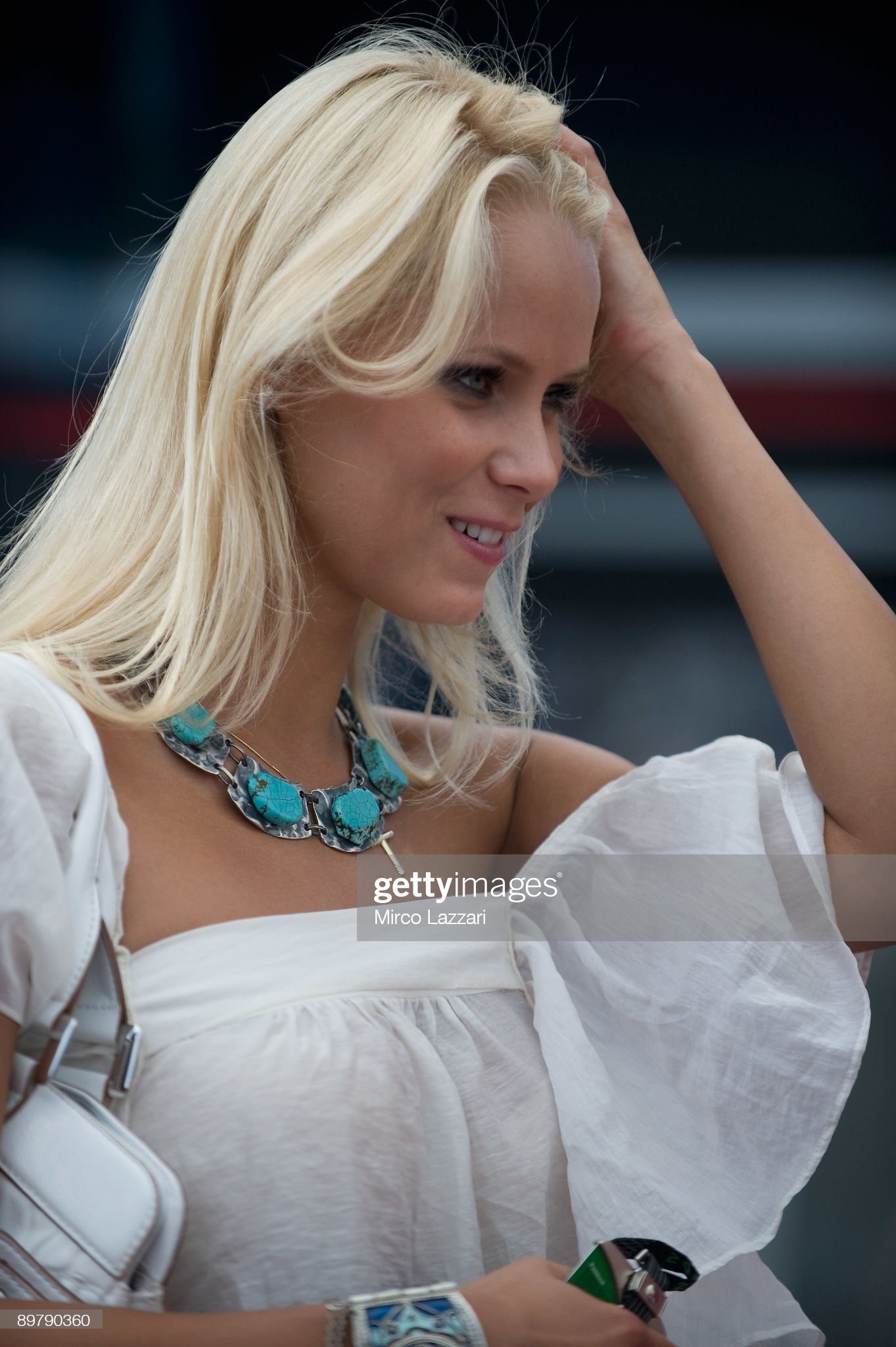 A grid girl poses for fans during the pit walk of the MotoGP World Championship Grand Prix of Czech Republic on August 14, 2009 in Brno, Czech Republic. 