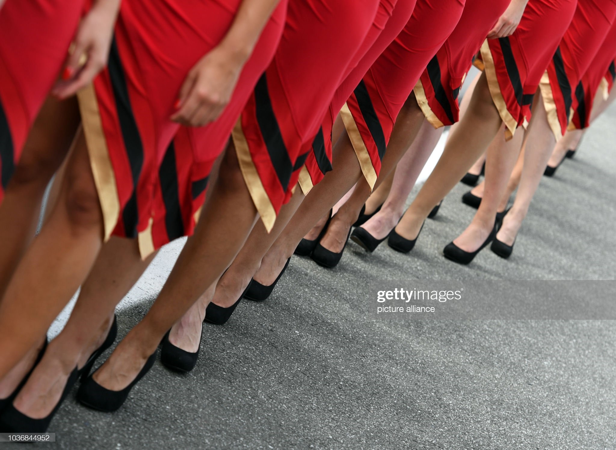 Grid Girls stand on the pit lane after the qualifying of the German Grand Prix at Hockenheimring in Hockenheim, Germany, on 30 July 2016. 