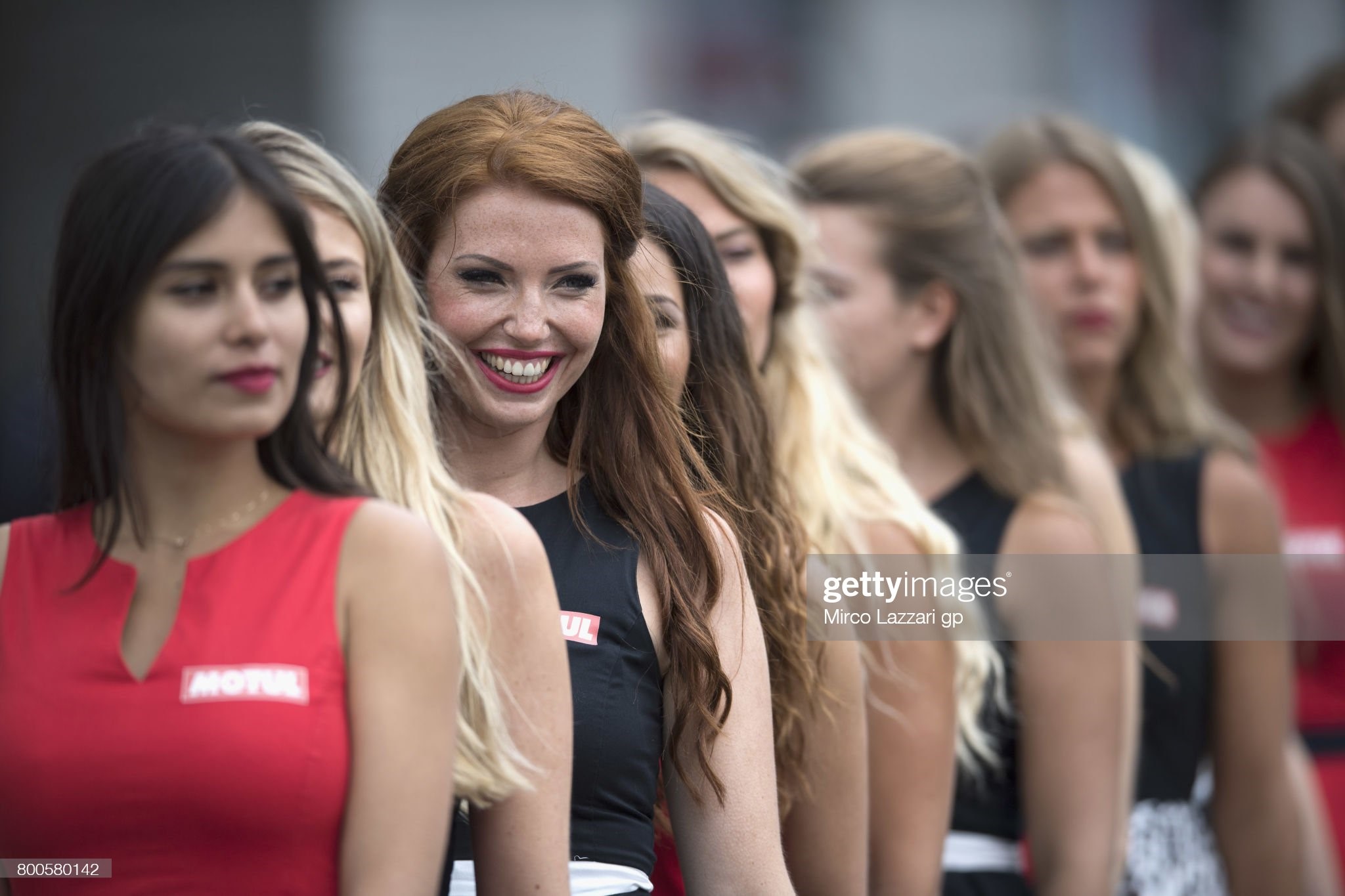The grid girls smile in paddock during the qualifying of the MotoGP of the Netherlands on June 24, 2017 in Assen, Netherlands. 