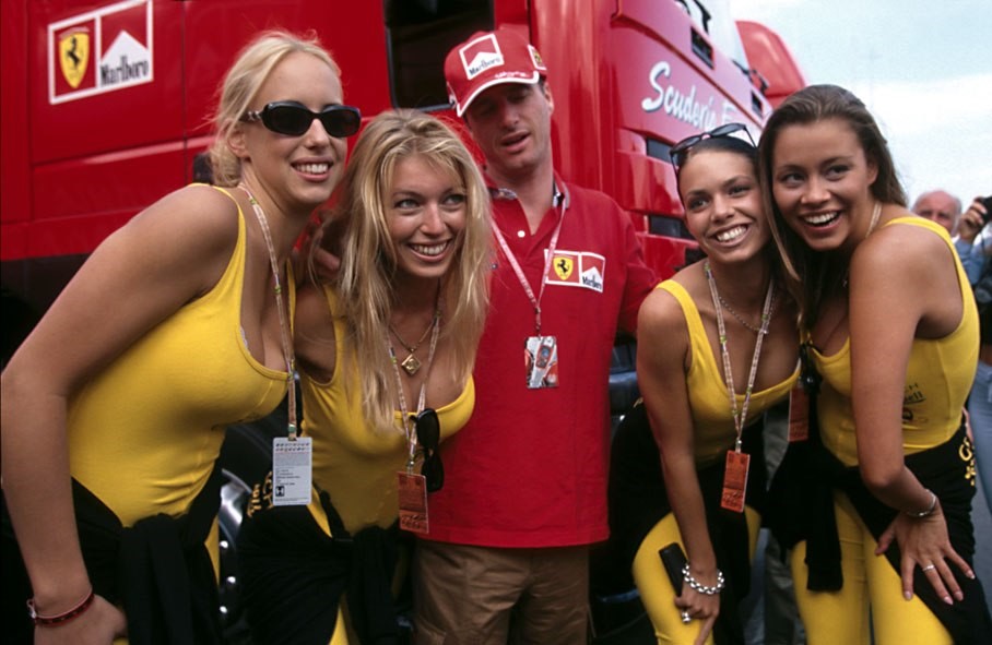 Ferrari driver Eddie Irvine with Formula 1 grid girls at Budapest, Hungary, in 1999. 