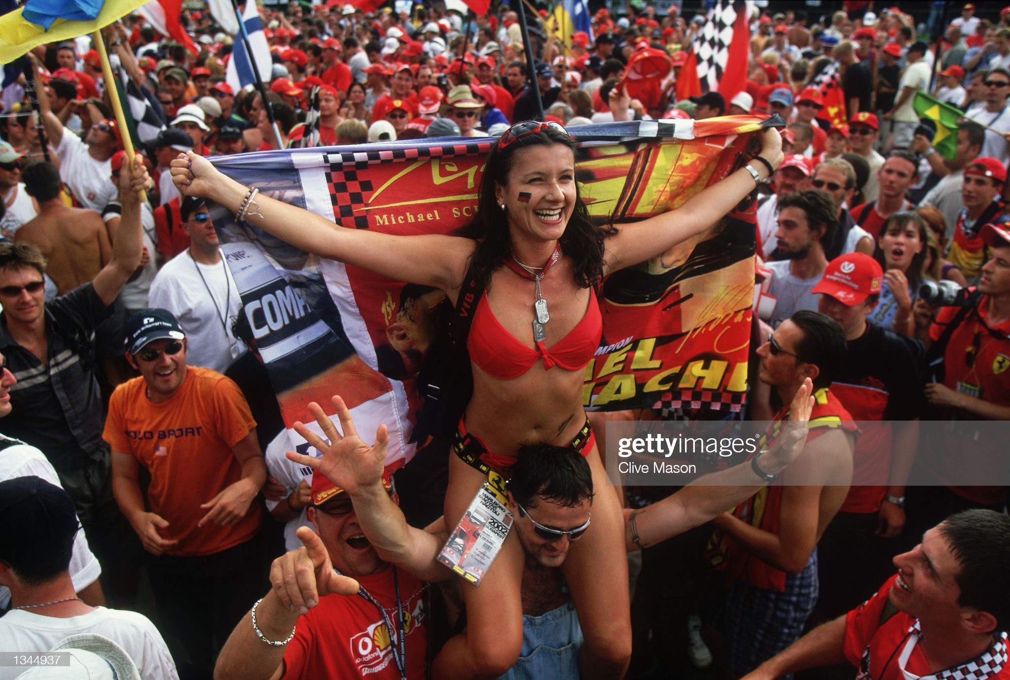 The Ferrari tifosi add some glamour to the post race celebration during the Formula One Hungarian Grand Prix held at the Hungaroring Circuit, Budapest, Hungary, on the 18th of August 2002.