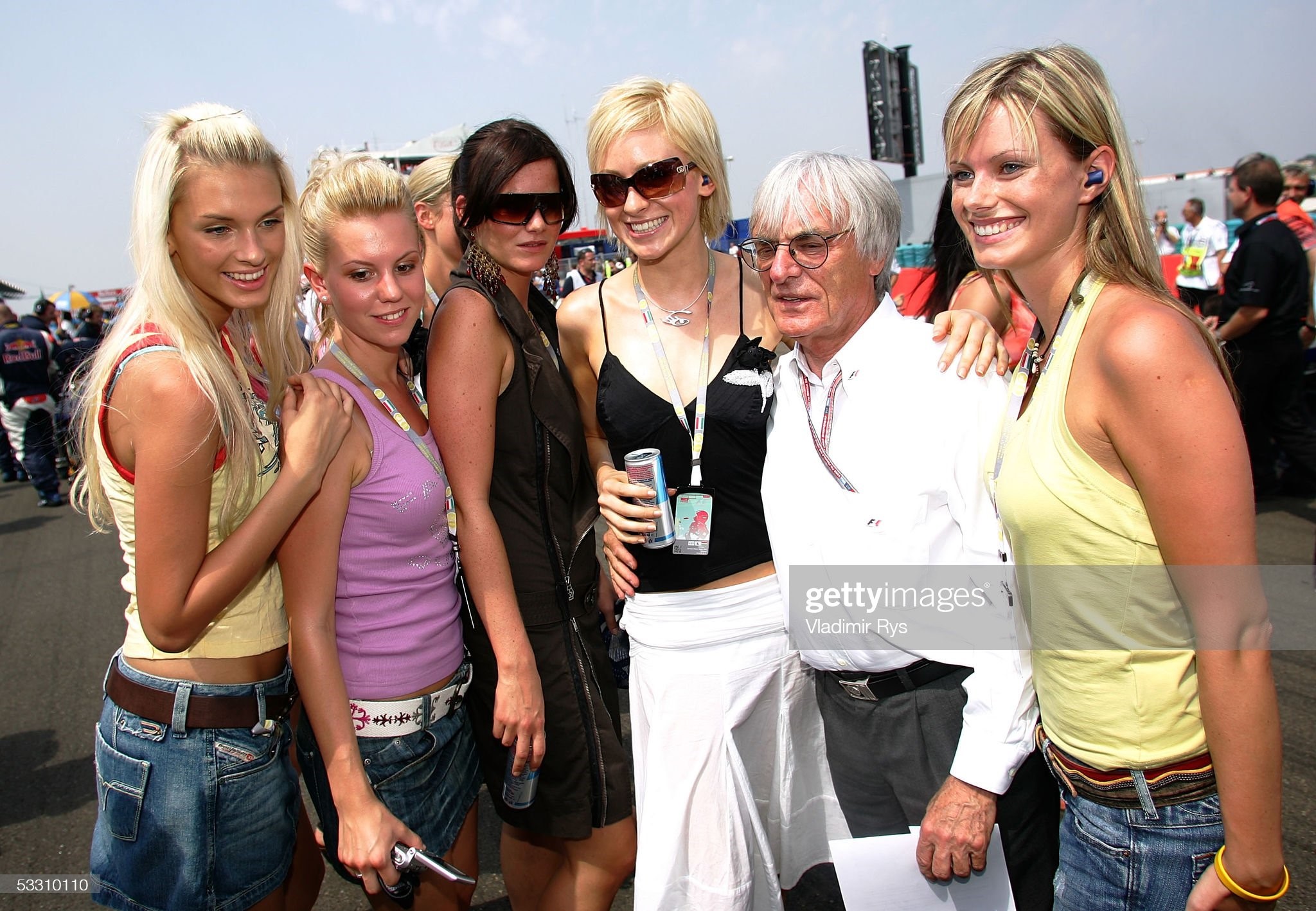 Bernie Ecclestone pose on the starting grid with the girls for the photographers before the Hungarian F1 Grand Prix on July 31, 2005 in Budapest, Hungary. 