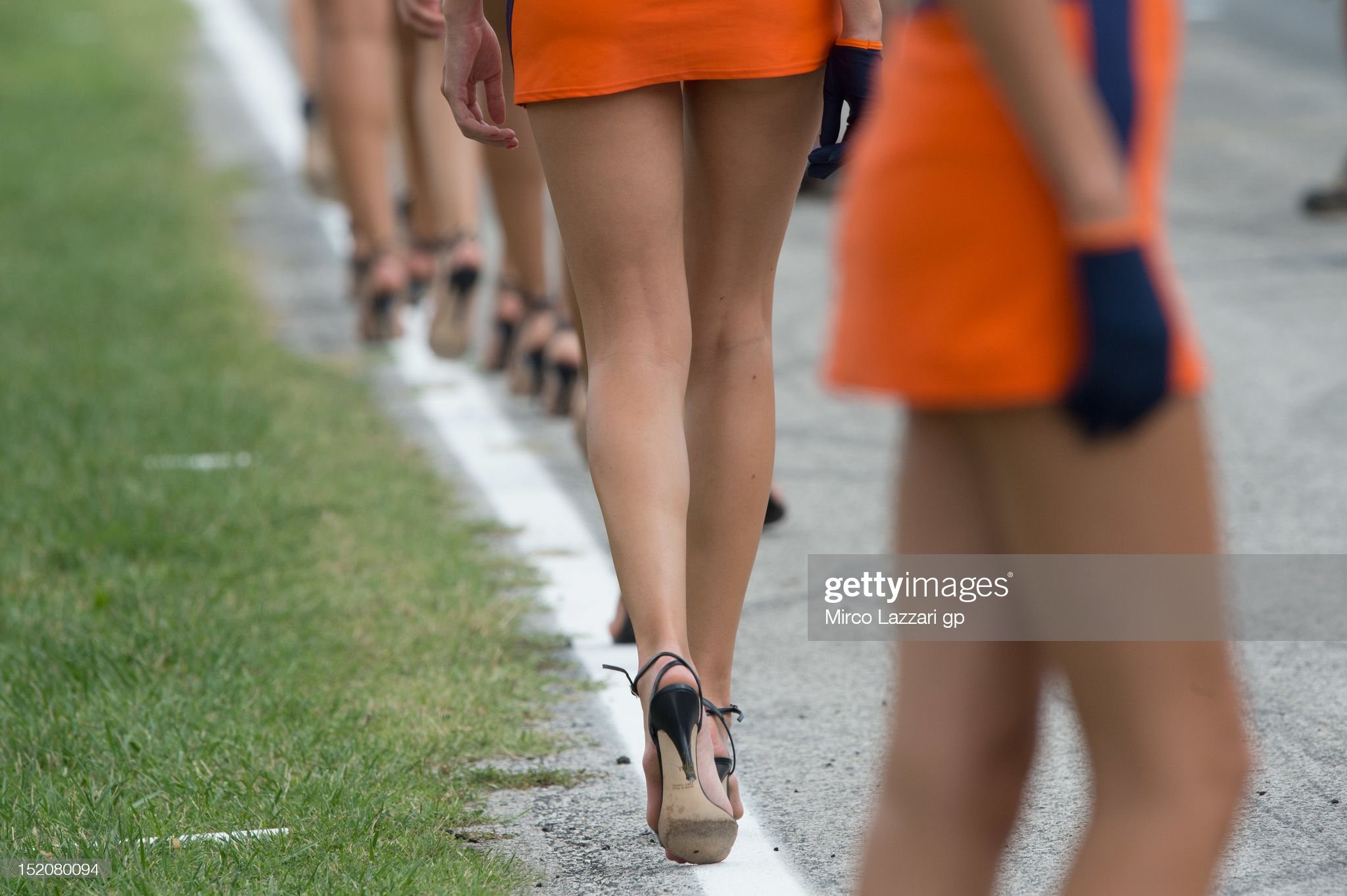 Grid girls walk on the grid during the MotoGP of San Marino at Misano World Circuit on September 16, 2012 in Misano Adriatico, Italy. 