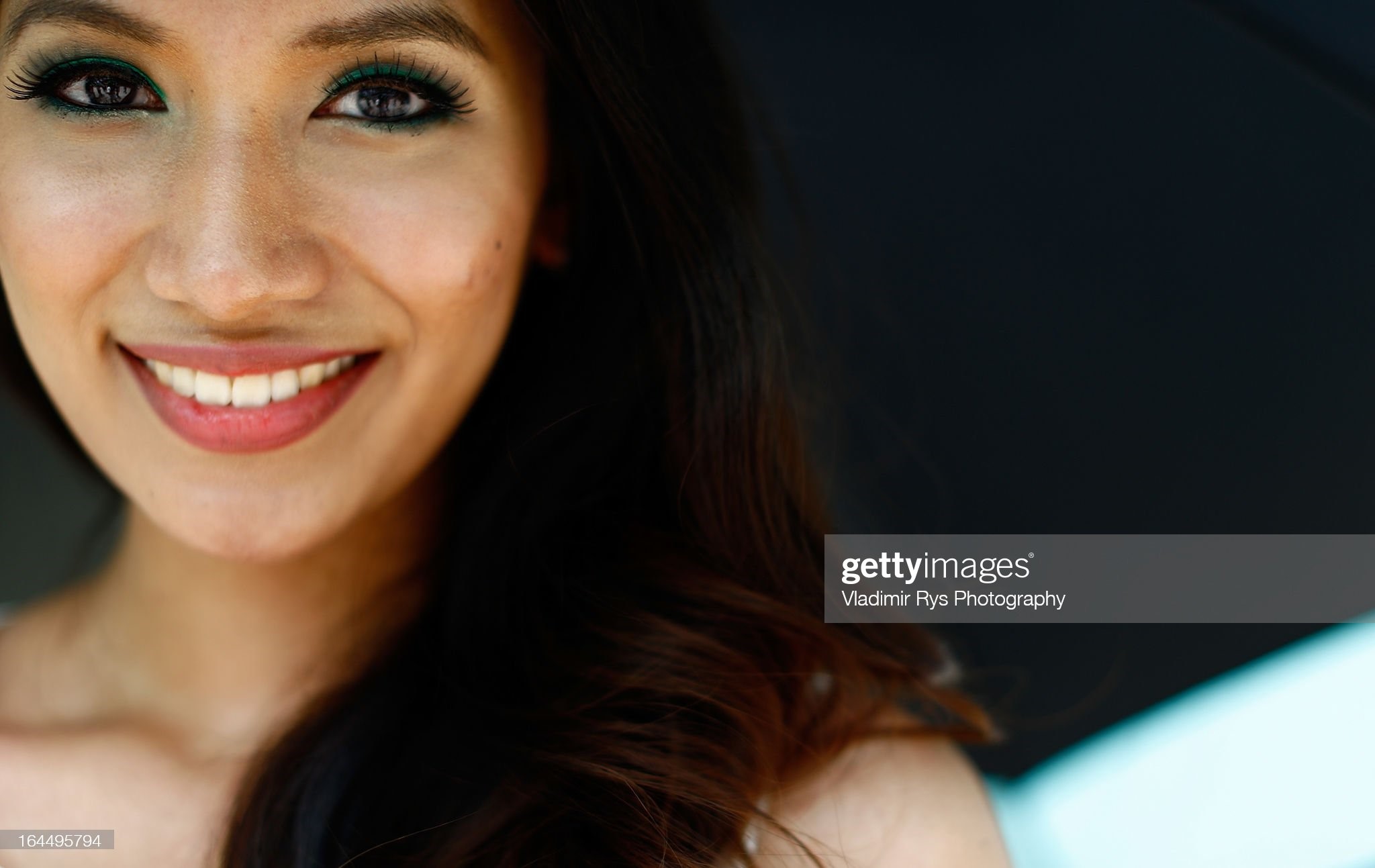 Grid girl poses for a picture ahead of the Malaysian Formula One Grand Prix at Sepang International Circuit on March 24, 2013 in Kuala Lumpur, Malaysia. 