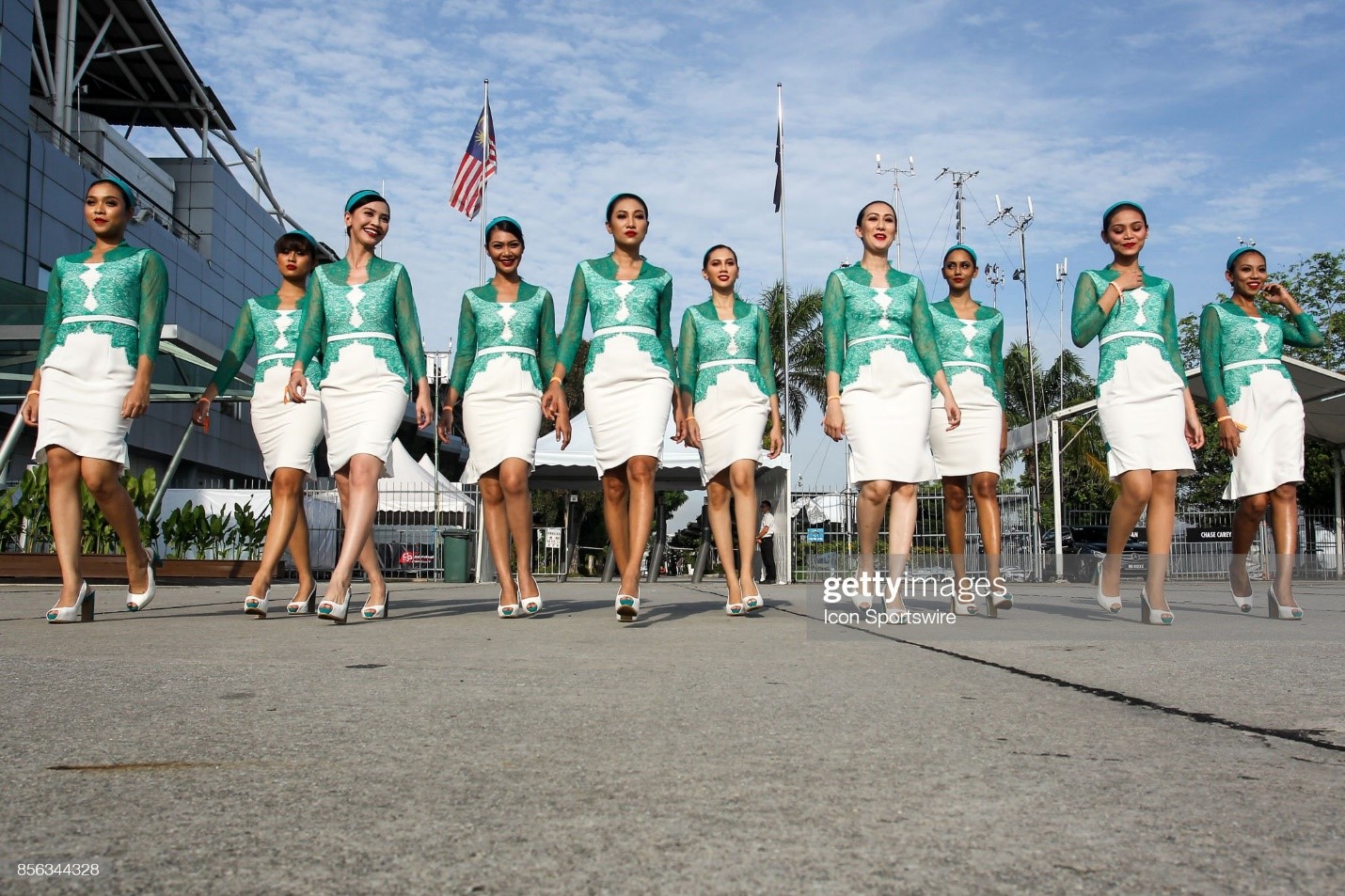 Grid girls pose for photograph before the start of the race of the Formula 1 Malaysia Grand Prix held at Sepang International Circuit in Sepang, Malaysia, on October 01, 2017. 