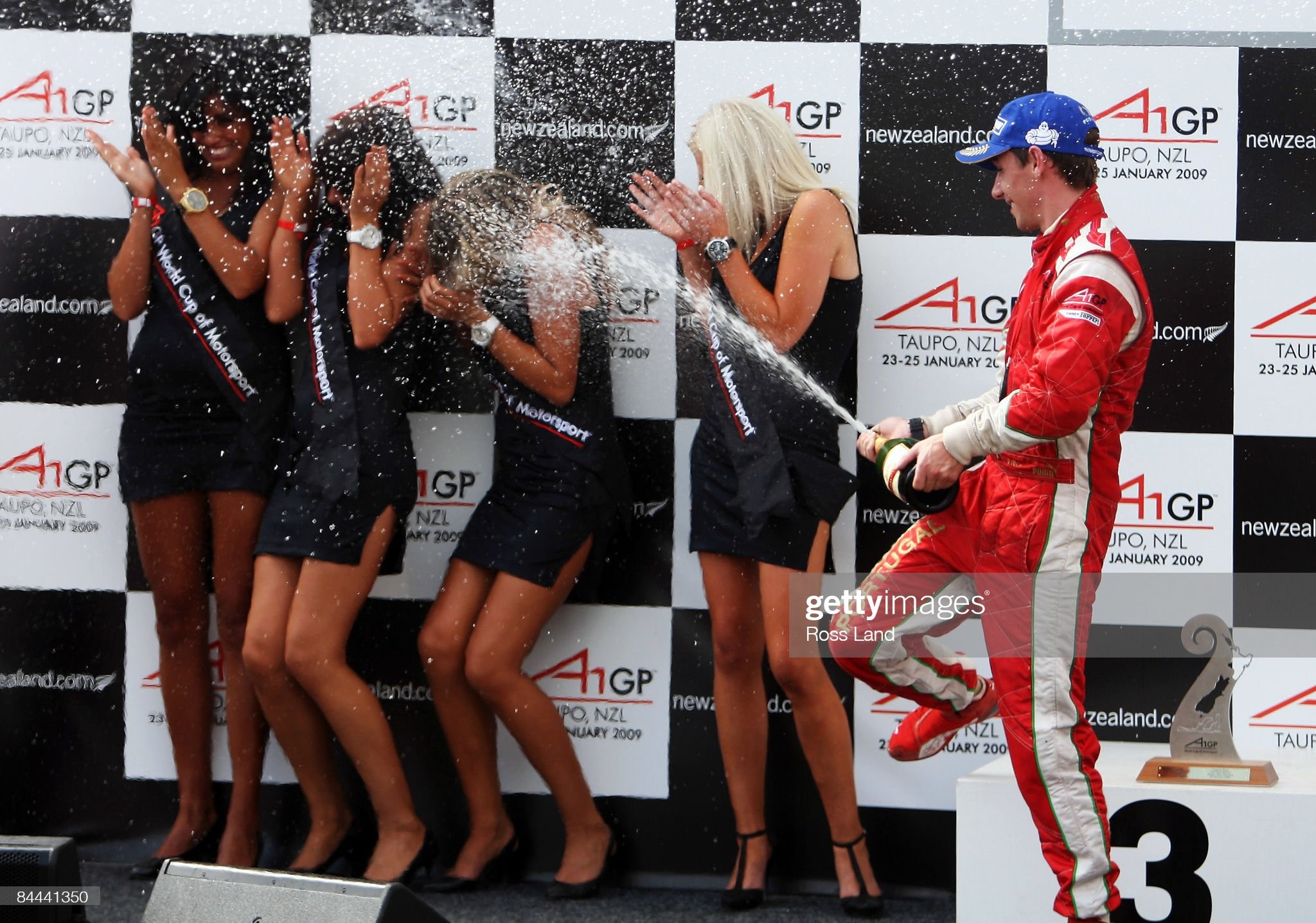 Filepe Albuquerque of Portugal sprays the grid girls with champagne following the feature race at the New Zealand A1 Grand Prix at the Taupo Race Track on January 25, 2009 in Taupo, New Zealand. 