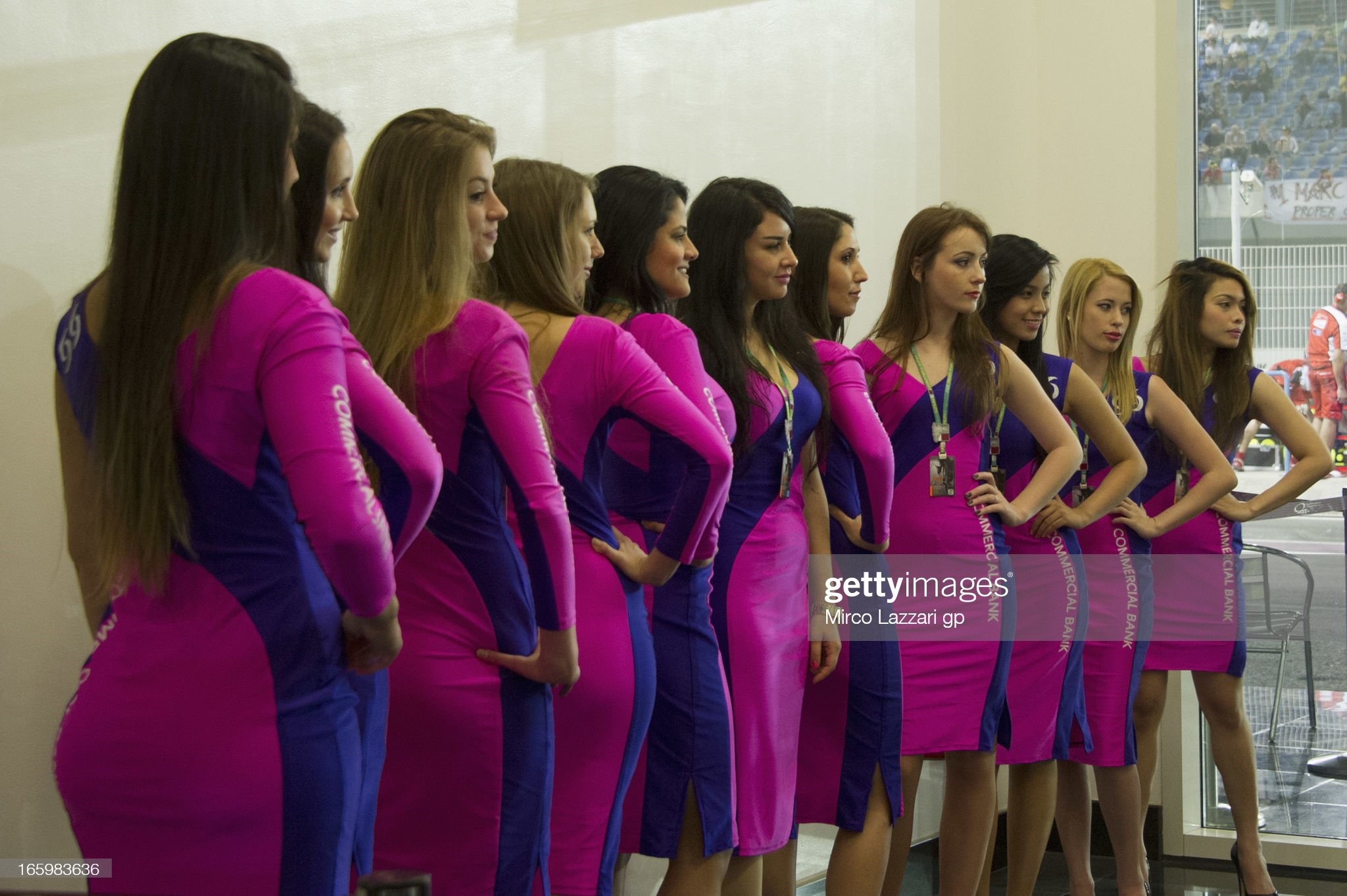 The grid girls prepare themselves before the start of the MotoGP race of Qatar at Losail Circuit on April 07, 2013 in Doha, Qatar. 