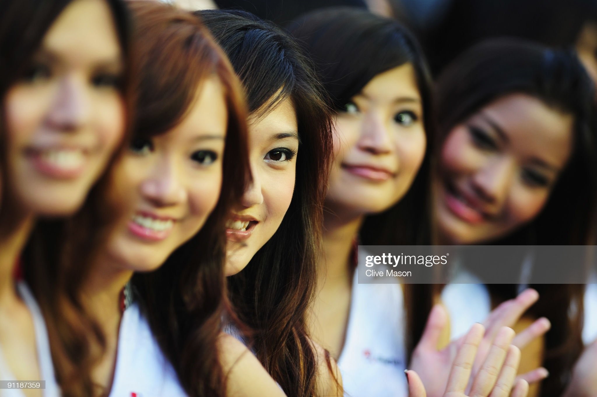 Grid girls are seen before the Singapore Formula One Grand Prix at the Marina Bay Street Circuit on September 27, 2009 in Singapore.