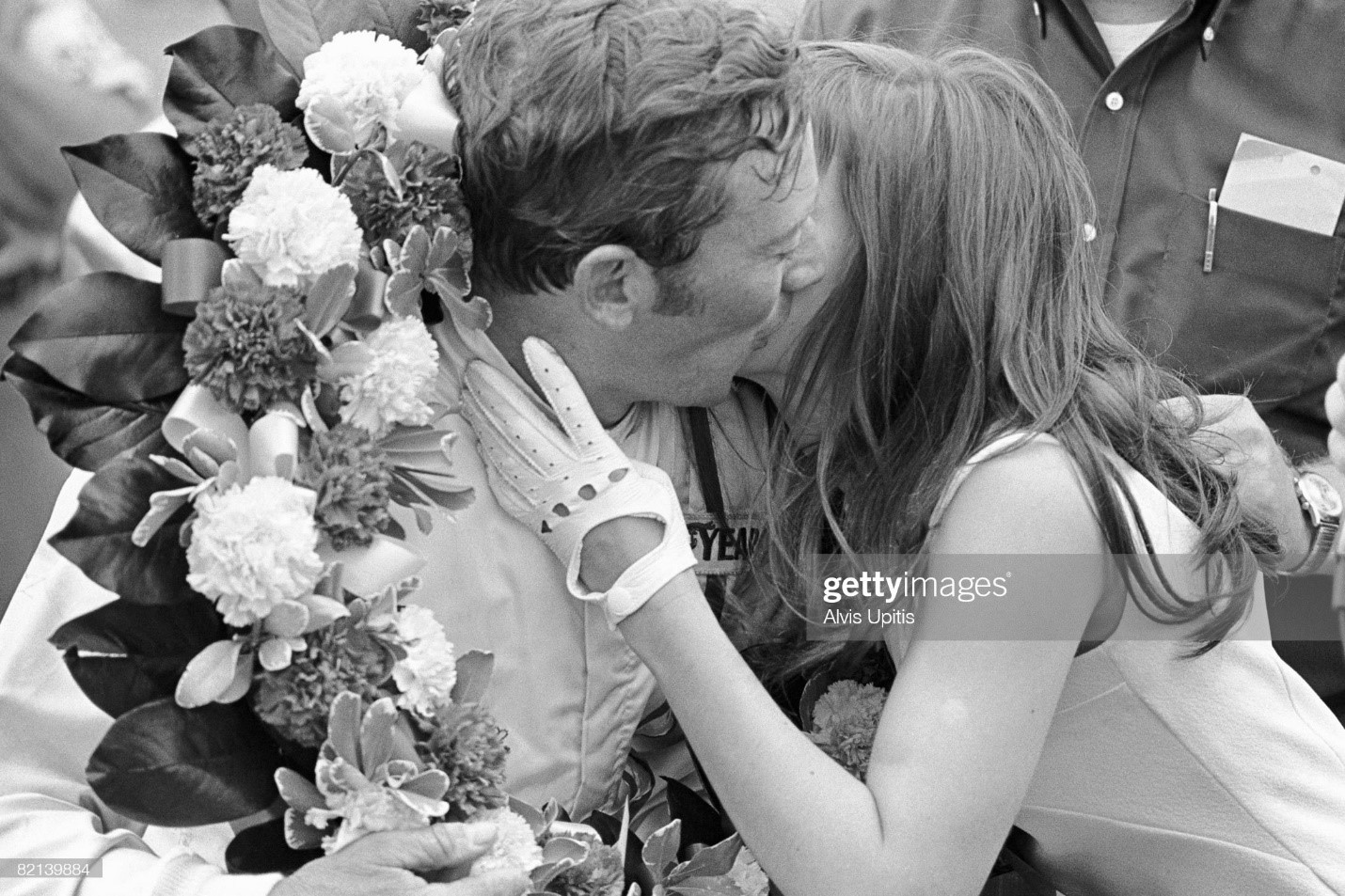 Gary Bettenhausen kisses race queen after winning the USAC Champ Car race as part of the unusual Twin Bill for stock and open wheel racers on July 4, 1970 at Michigan International Raceway in Brooklyn, Michigan. 