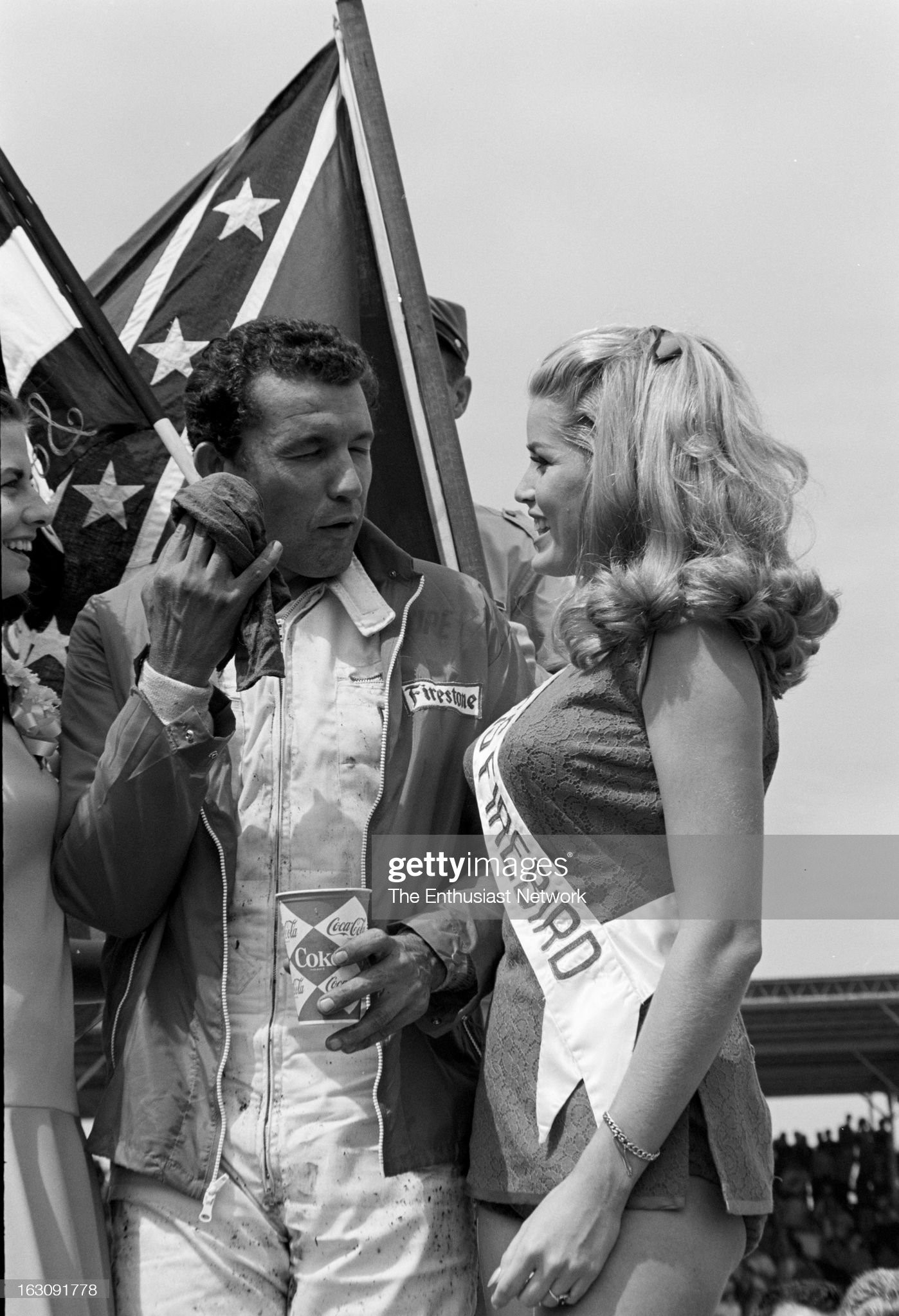 United States, September 06, 1967, Darlington Southern 500. Race winner Richard Petty celebrates his victory with the Southern 500 Race queen (left) and miss Firebird. 