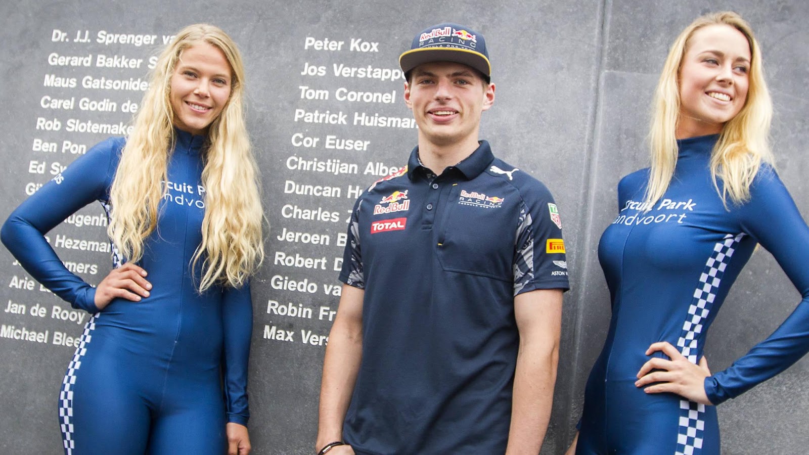 Max Verstappen at Zandvoort with two girls.