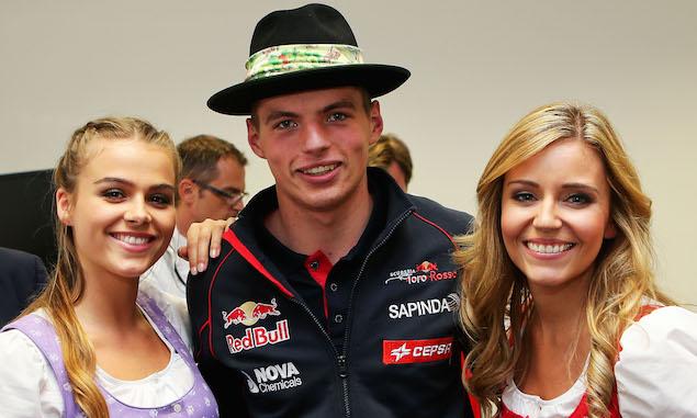 Max Verstappen with two girls.