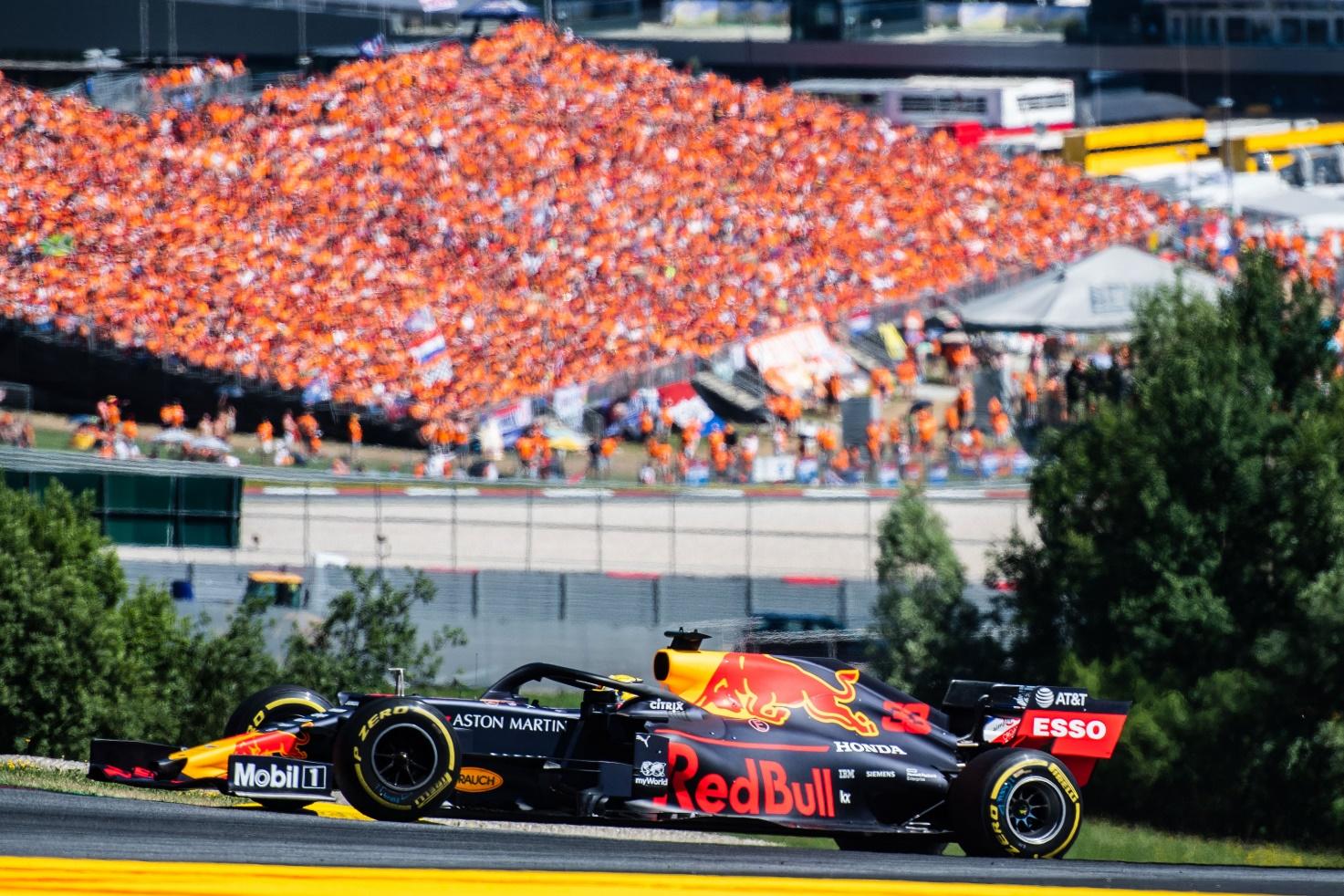 Max Verstappen and the orange wave of his supporters.
