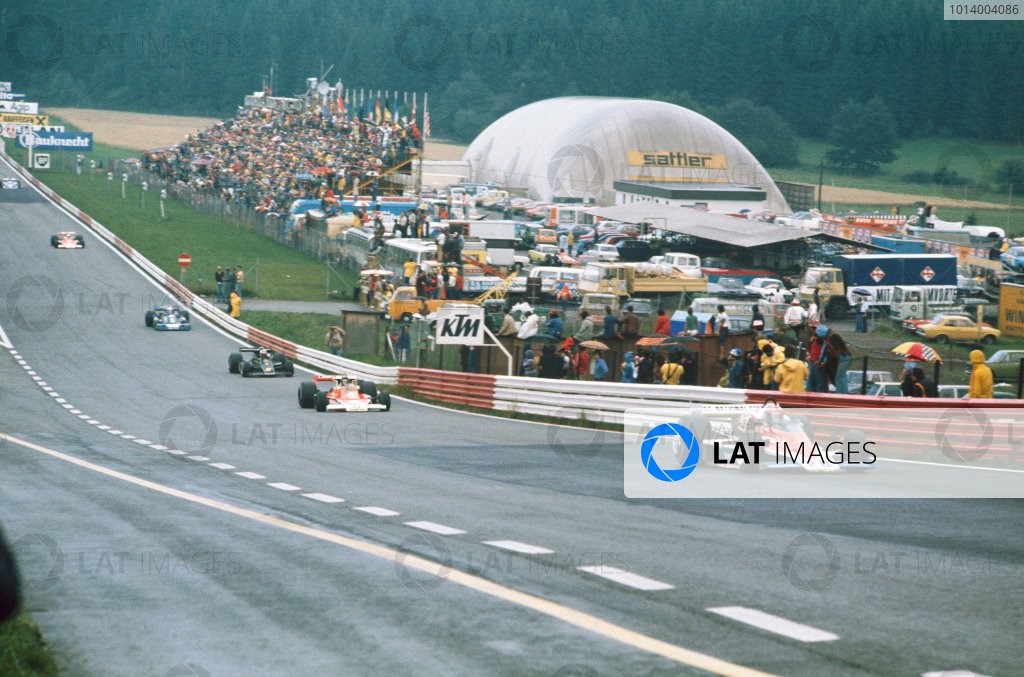 1976 Austrian Grand Prix. Osterreichring, Zeltweg, Austria. 13-15 August 1976. John Watson (Penske PC4-Ford), 1st position, leads James Hunt (McLaren M23-Ford), 4th position at the start of the race, action. 