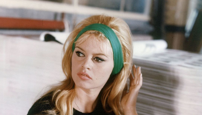 Brigitte Bardot and her red car