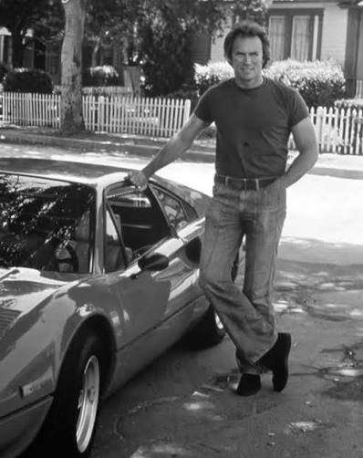 Clint Eastwood posing with a fresh-off-the-line Ferrari 308 GTB, in 1978.
