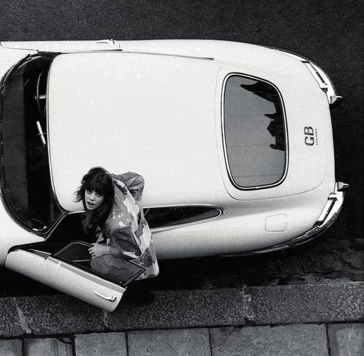 Jane Birkin hops in her Jaguar E-Type, 1965.