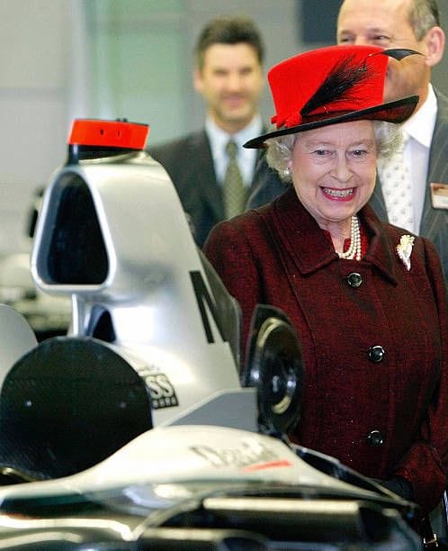Queen Elizabeth II watching a McLaren at Woking.