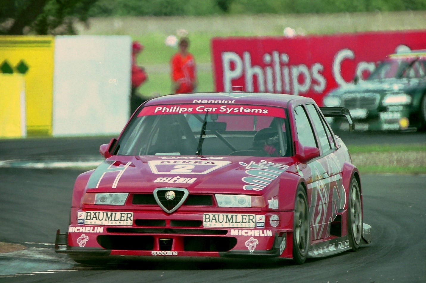 Nannini driving for Alfa Romeo at Donington Park during the 1994 Deutsche Tourenwagen Meisterschaft season.