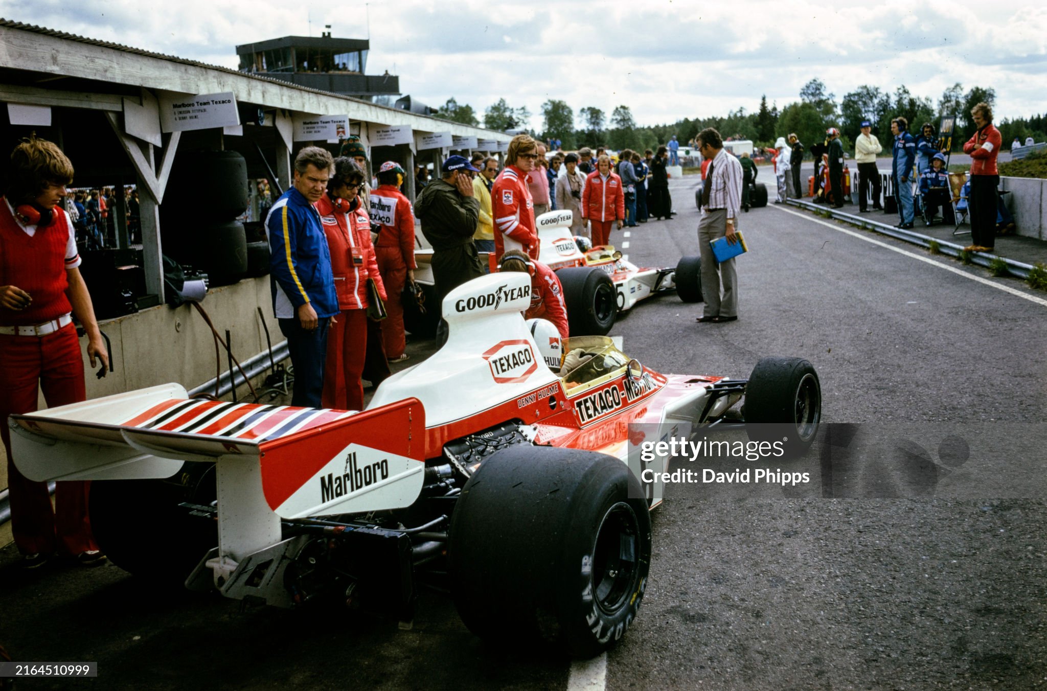 Alastair Cladwell oversees the McLaren M23 Fords of Emerson Fittipaldi and Denny Hulme. Designer Gordon Coppuck is also visible during the Swedish Grand Prix in Anderstorp on 09 June 1974. 