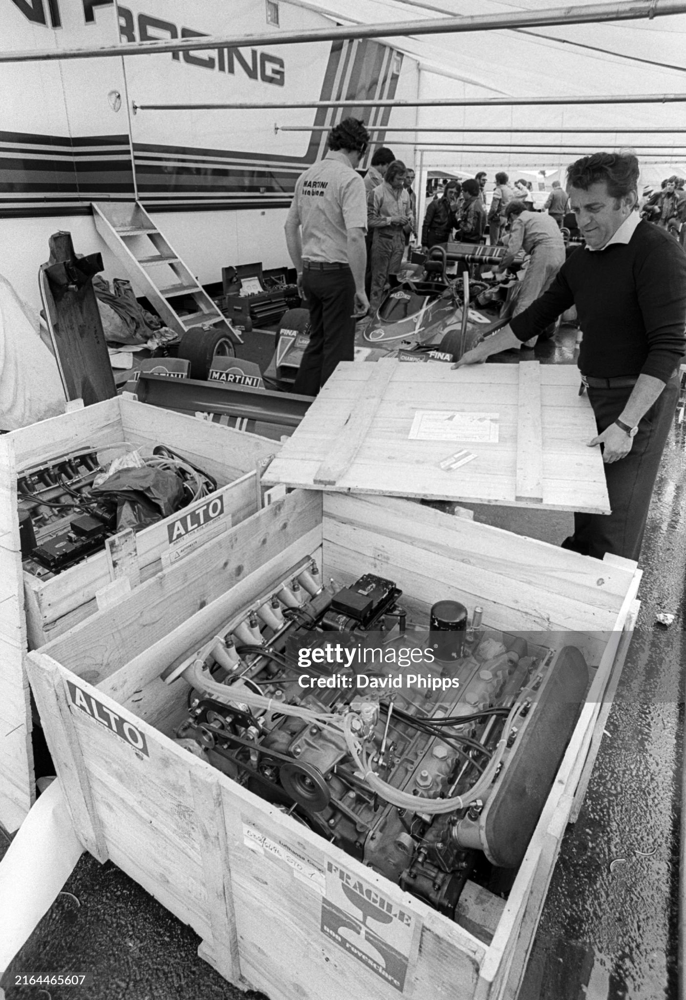 A Brabham mechanic in the paddock unpacks from the freight an Alfa Romeo flat 12 engine that powered the BT45 at the Grand Prix of Sweden in Anderstorp on 13 June 1976. 